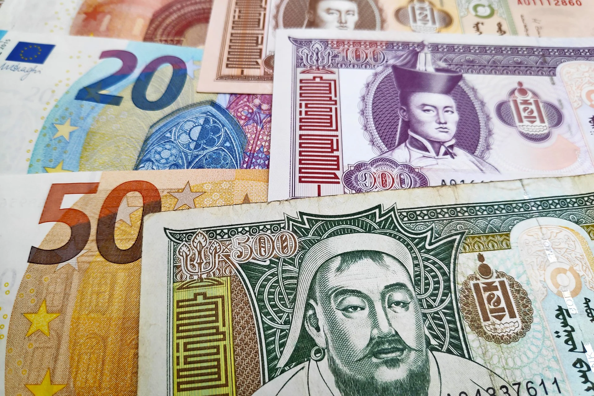 Collage of various international currencies.