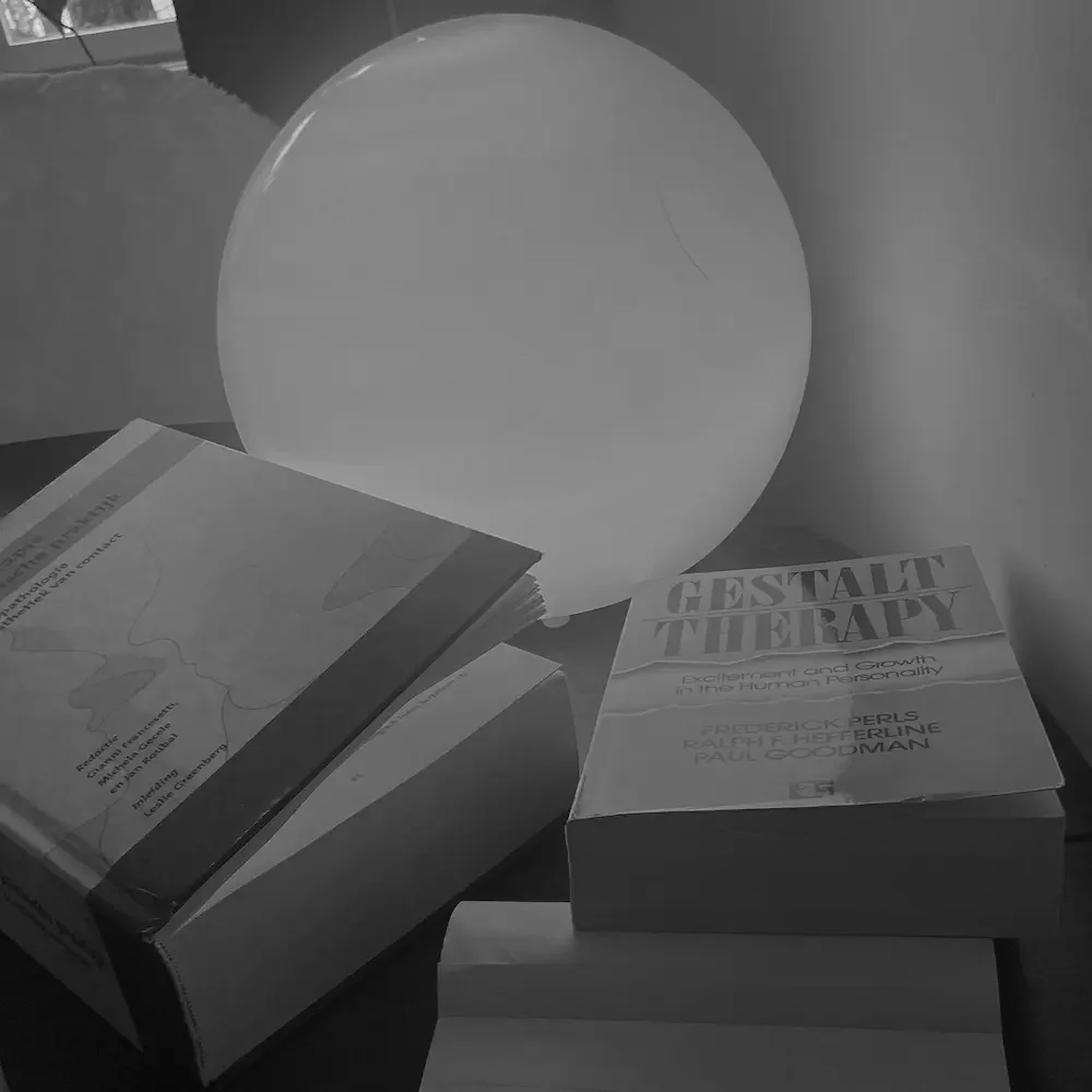 Books on Gestalt therapy by Frederick Perls, representing theory and professional development in Amsterdam