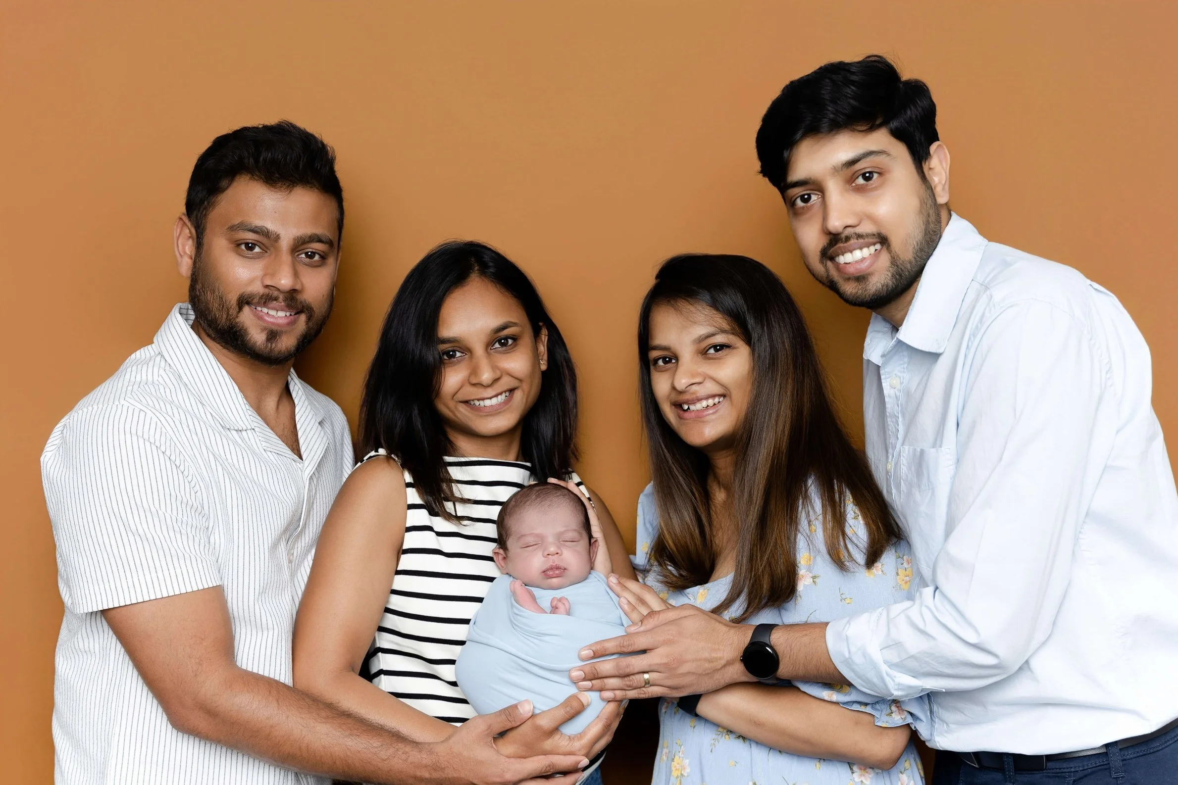 Family photo with newborn baby in Gentle Glances studio in Allen, TX