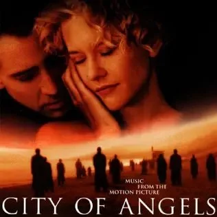 Close-up of a man and woman touching foreheads against a sunset background with silhouettes of people and the text 'City of Angels' and 'Music from the Motion Picture'.