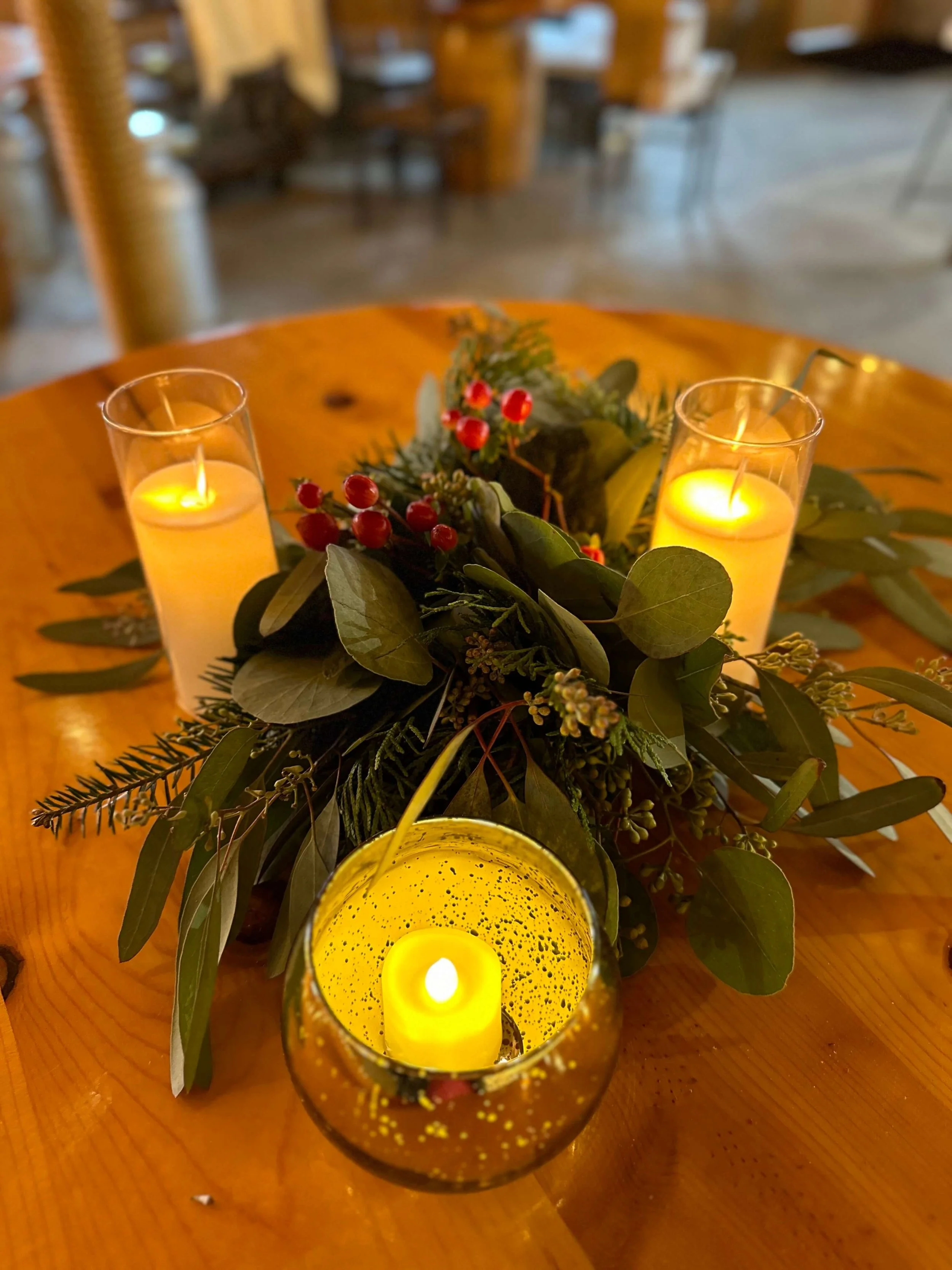 Winter Romance Wedding Centerpiece with White Roses and Frosted Greenery.jpg