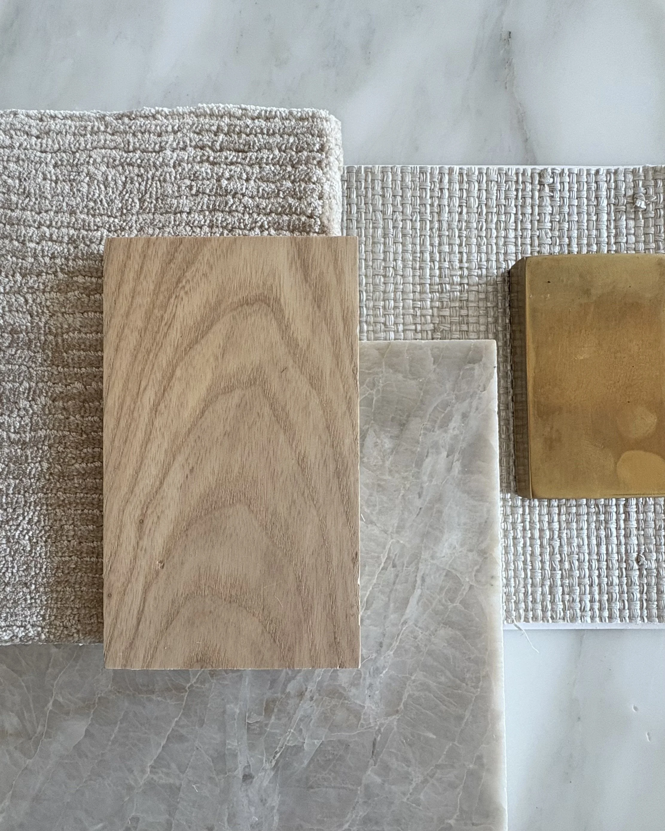 Interior design material selections including fabric, tile, and finishes for a residential project in Minneapolis by OLEILU