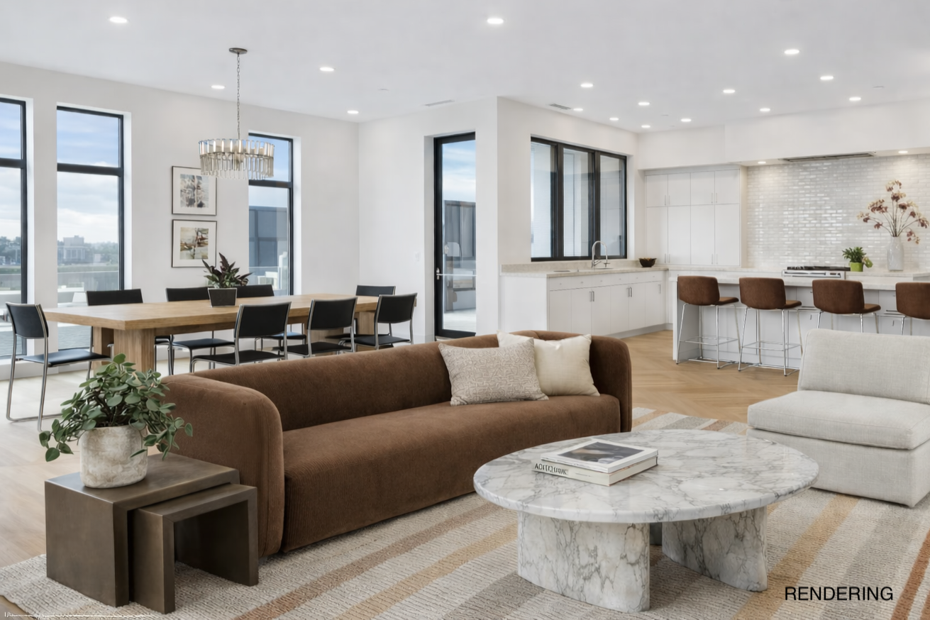 Open-concept living and dining area with large windows, modern furniture, and a kitchen with a white backsplash and island.