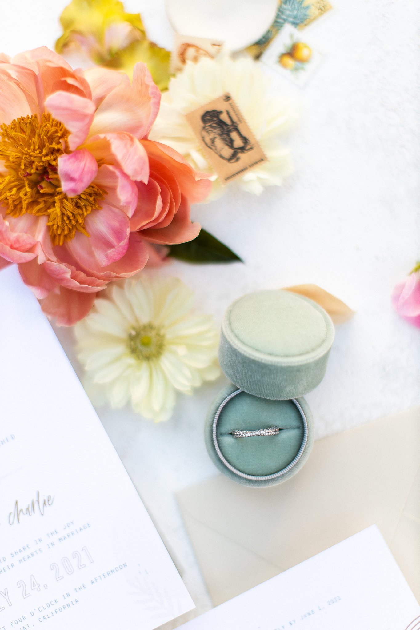 Citrus and sorbet-toned wedding bouquet with apricot, butter-yellow, and pale peach accents.