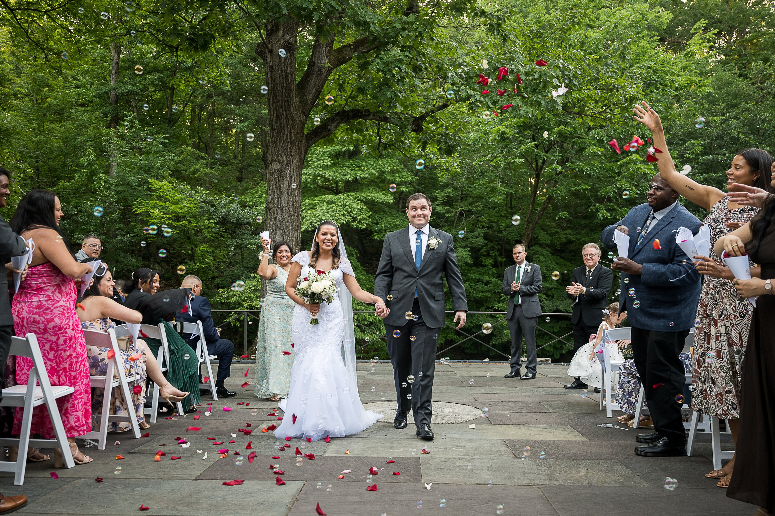 Wedding guests gathering during a garden ceremony in New York City
