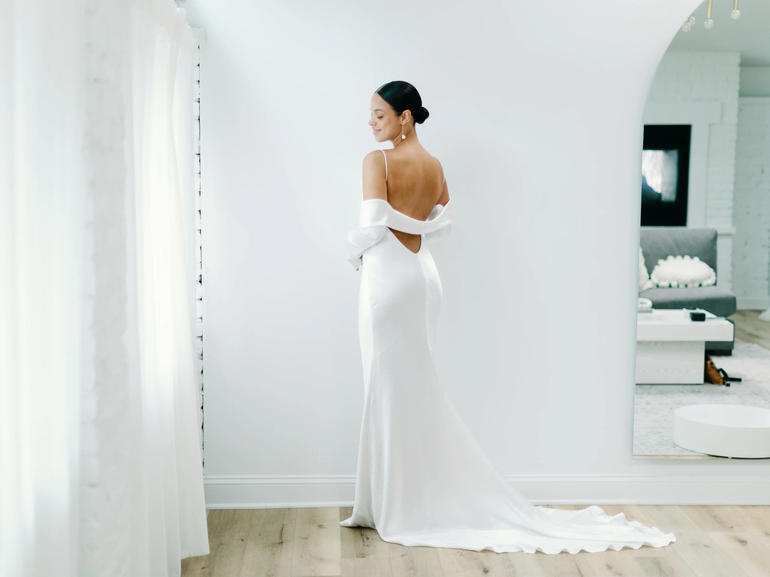 Editorial close-up of lace and sheer fabric, emphasizing softness, detail, and romantic movement in a refined wedding design aesthetic