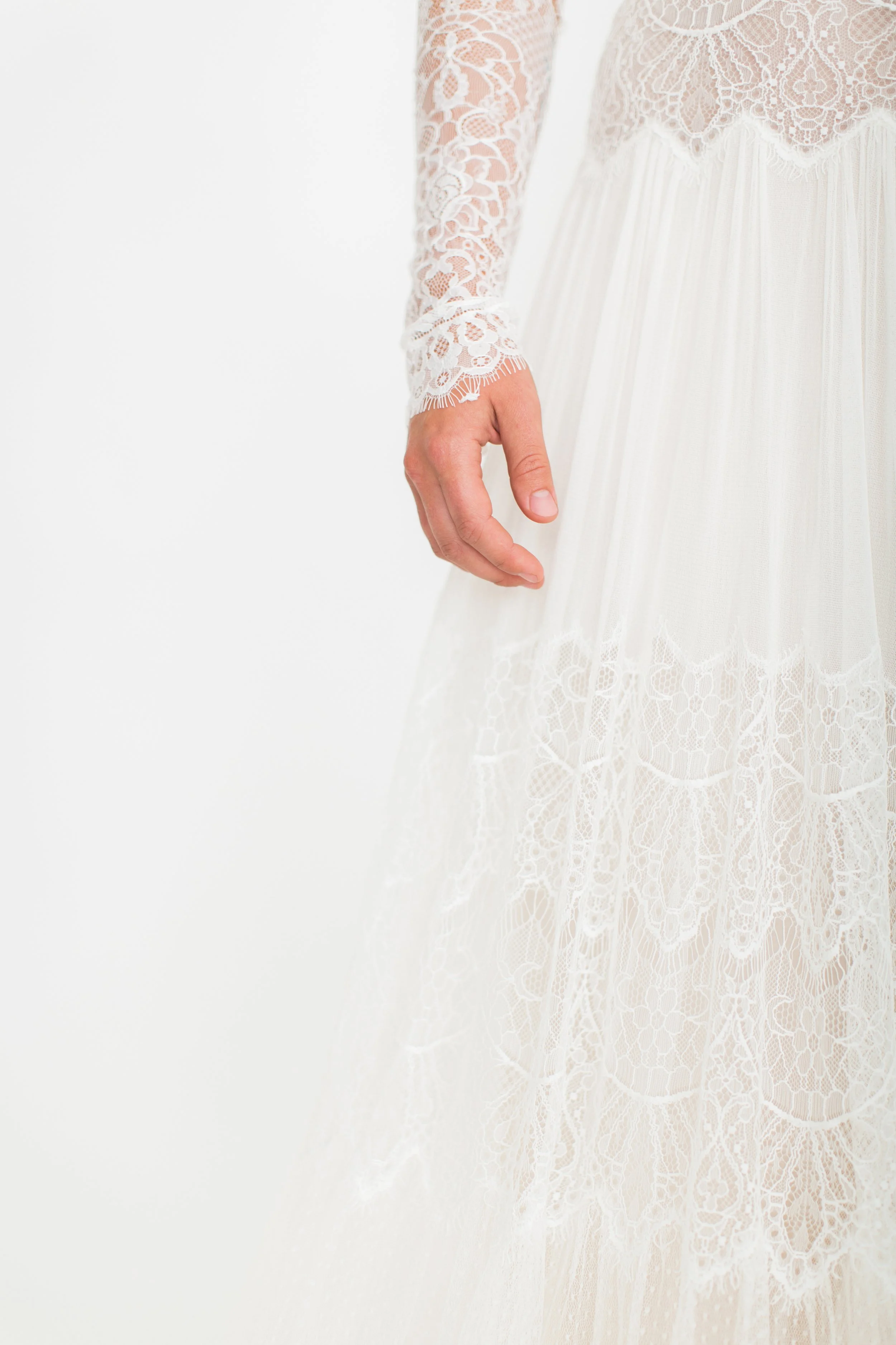 Soft bridal fabric and lace detail captured up close, creating a light and romantic visual texture