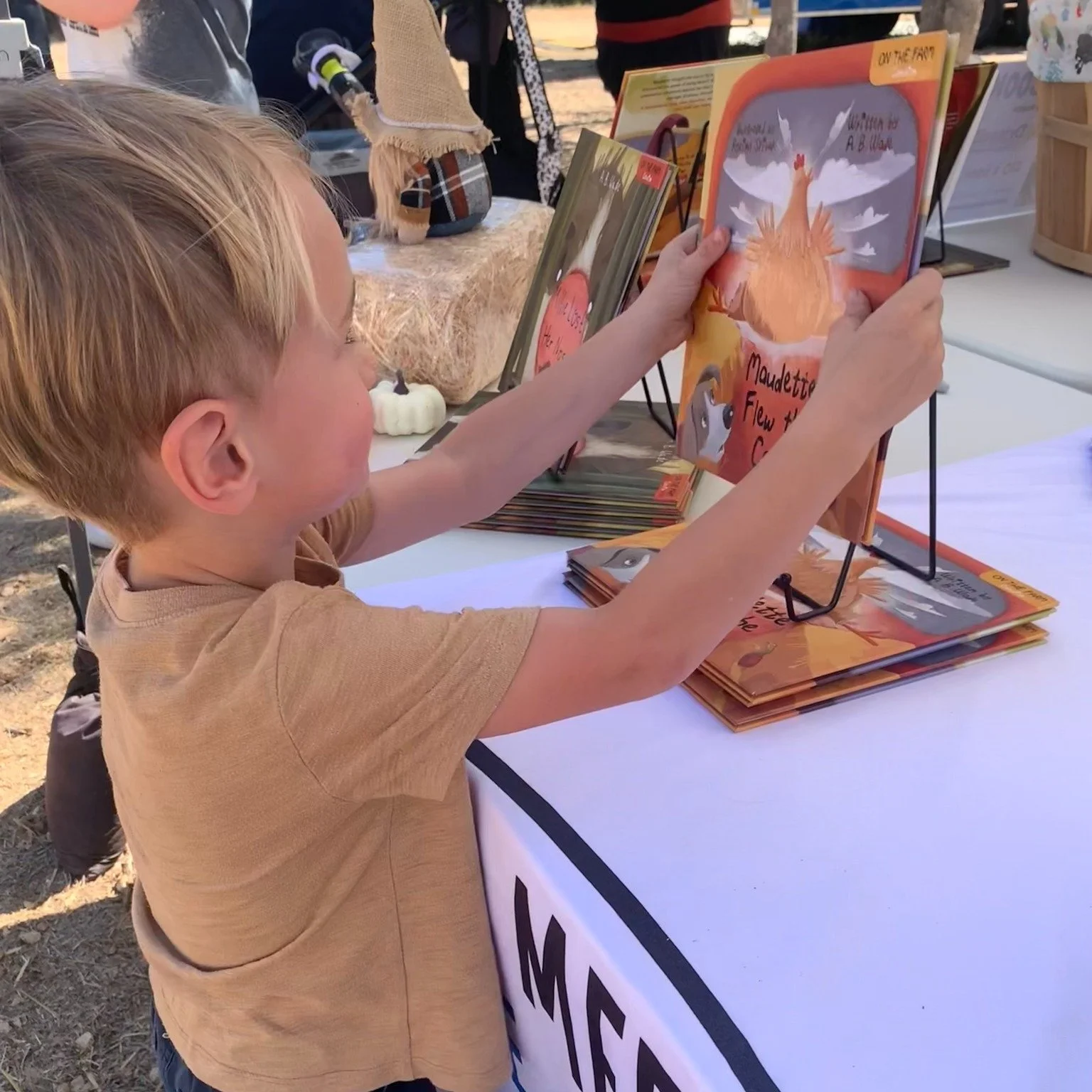 One of my favorite parts of events?

When a kid wanders up to my table, grabs a book, and instantly gets lost in the pages. 

Books matter. Kids matter. And seeing them fall in love with reading will never get old.

Thanks to every family who stops b