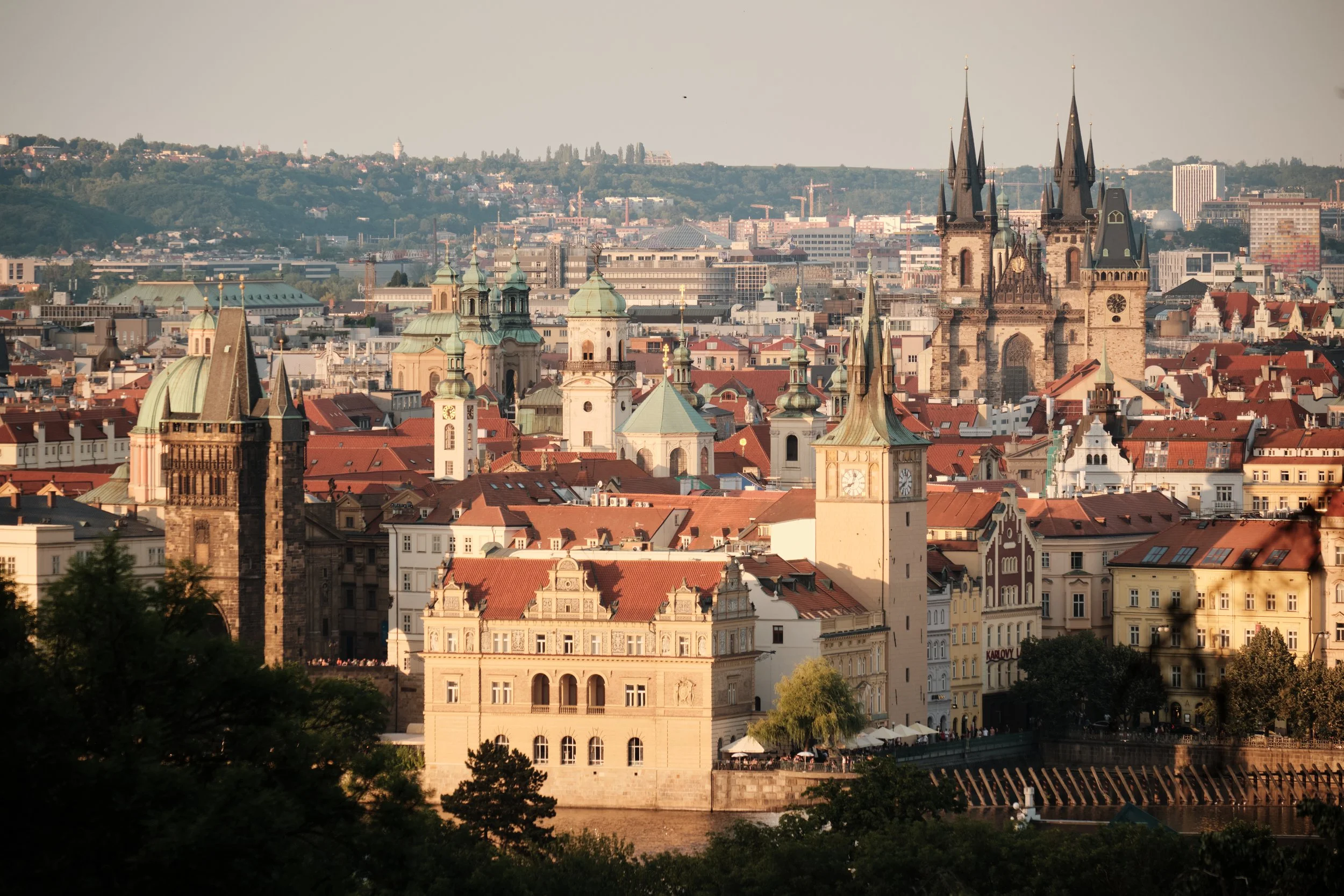 Golden hour reveals Prague at its most timeless. Viewed from Petřín Hill, the city’s layered rooftops, church spires, and historic landmarks create a skyline unlike any other in Europe.