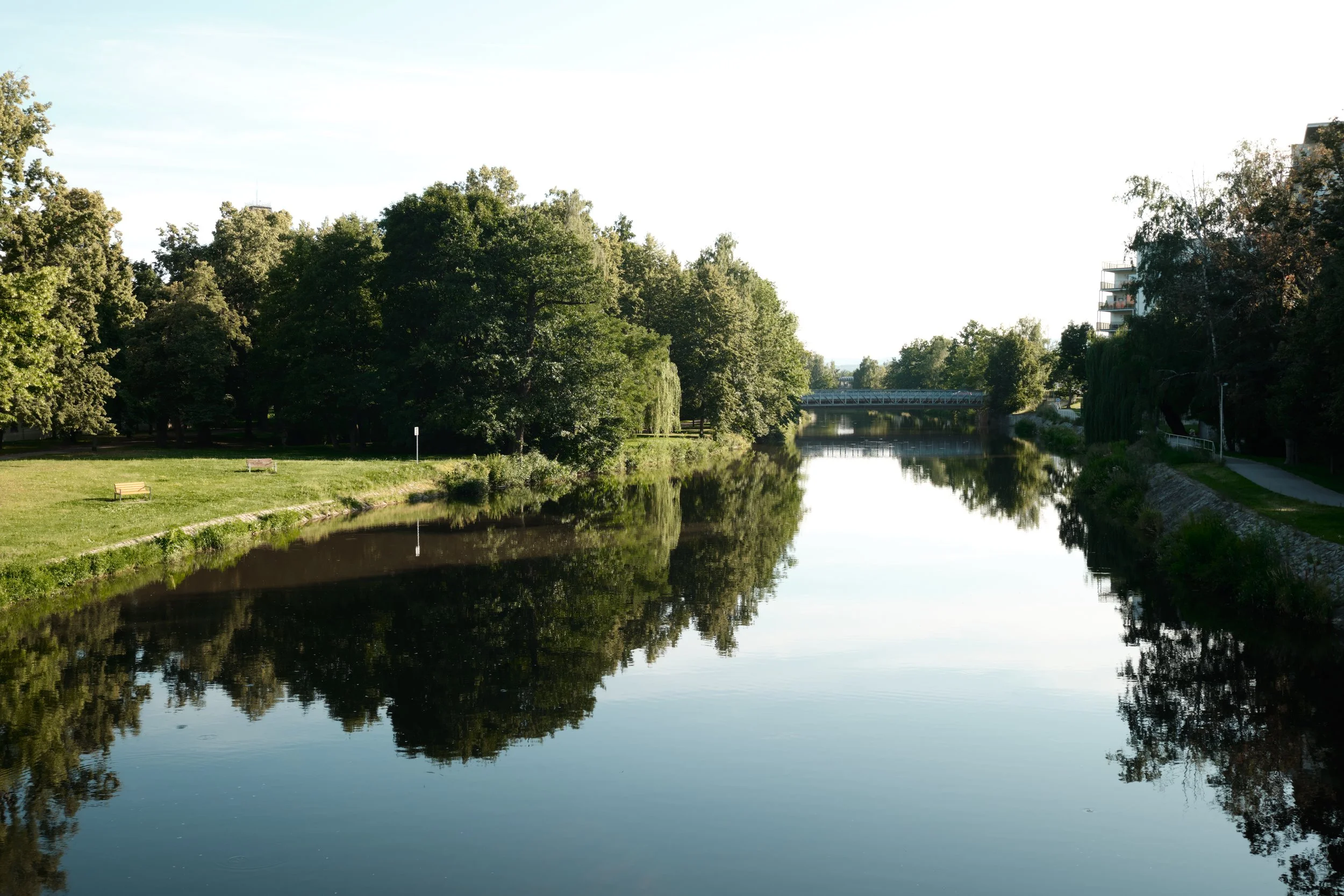 The gentle flow of the Vltava River meets the peaceful greenery of Stromovka Park, creating one of České Budějovice’s quietest corners. On warm summer evenings, the still water mirrors the surrounding trees, offering a moment of calm away from the ci