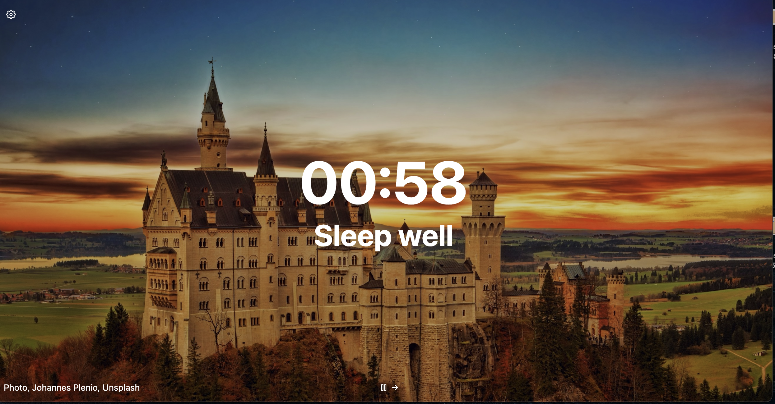 Screenshot of a minimalist Tabliss new tab page with a calming nature background and clock widget