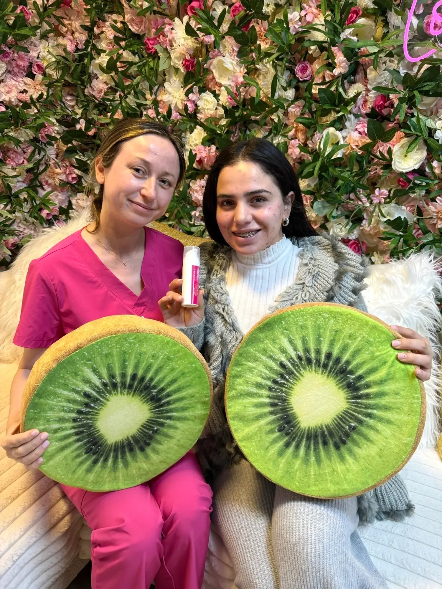 A woman with her esthetician smiling after an acne facial San Diego
