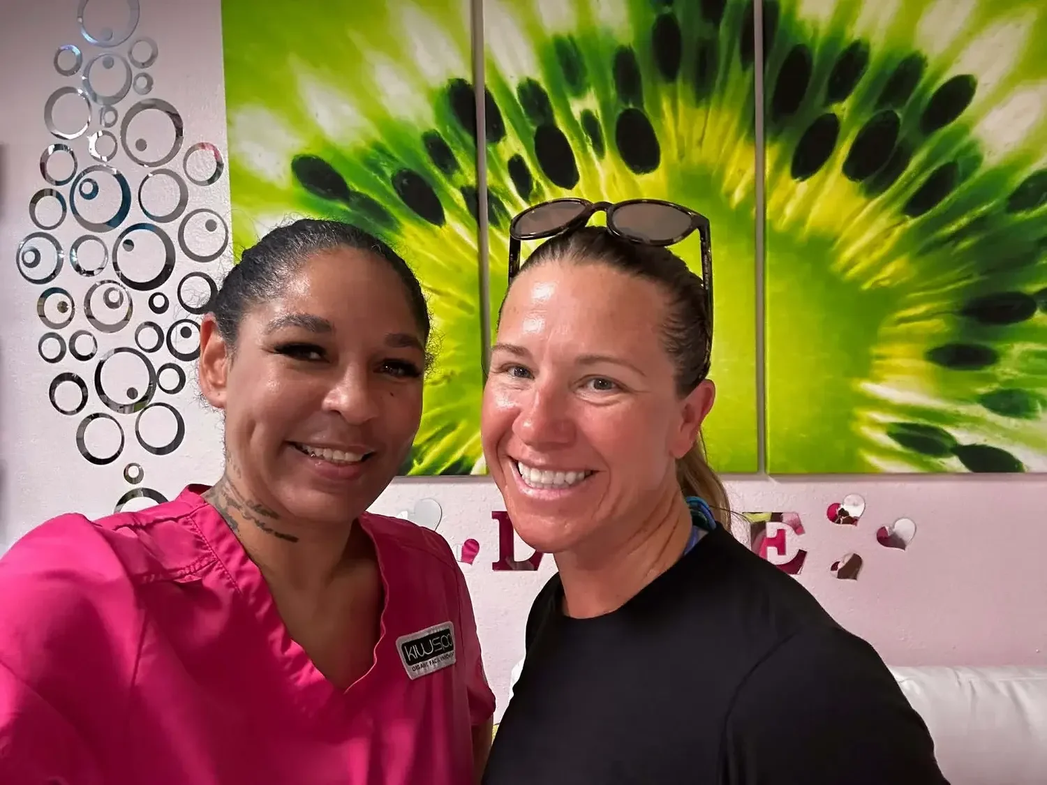 Women side by side smiling after an anti aging facial at Kiwi Spa San Diego