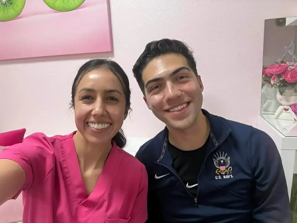 A man with glowing skin with his esthetician at Kiwi Spa