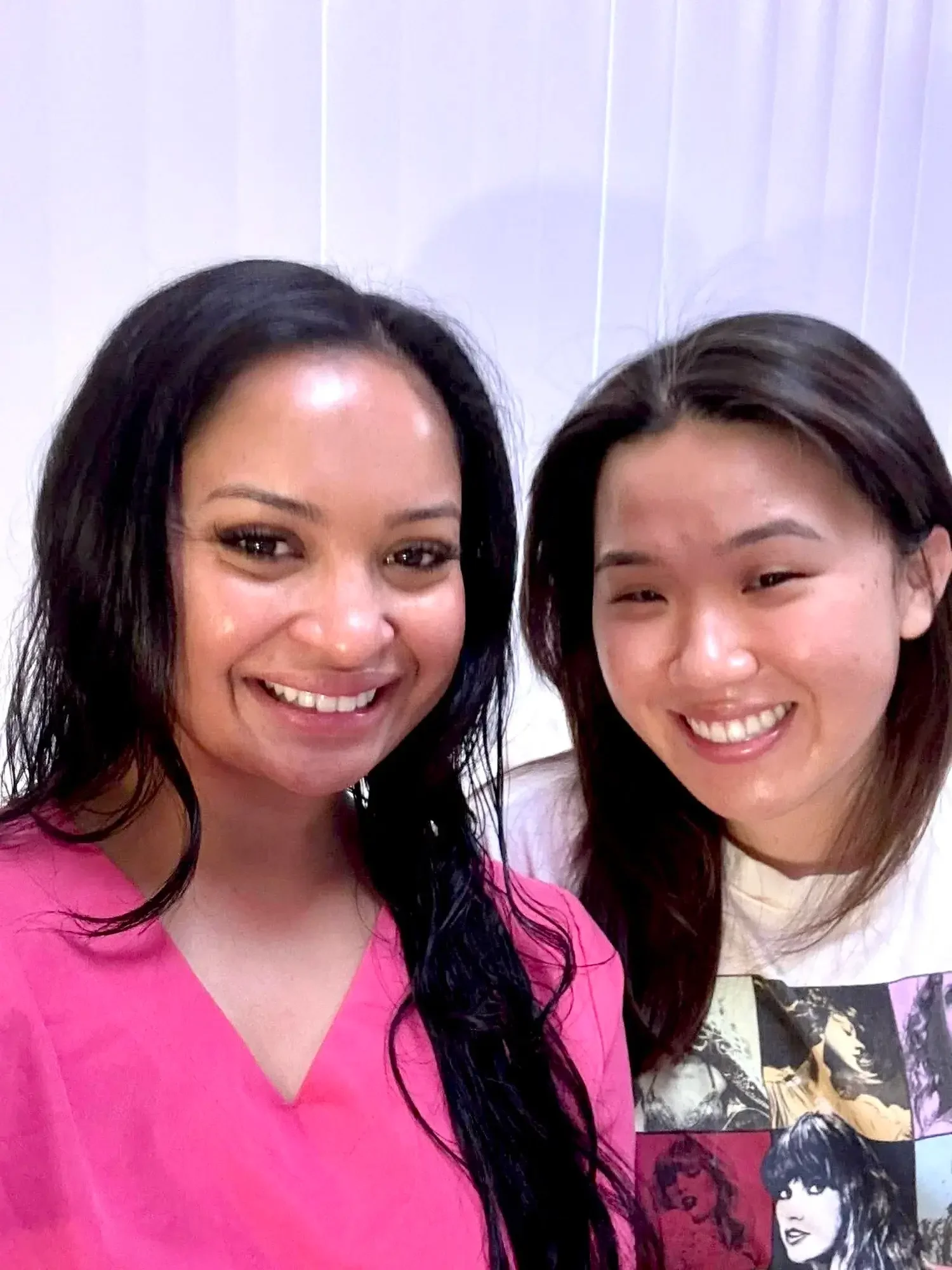 A client at Kiwi Spa smiling side by side with her esthetician, with glowing skin
