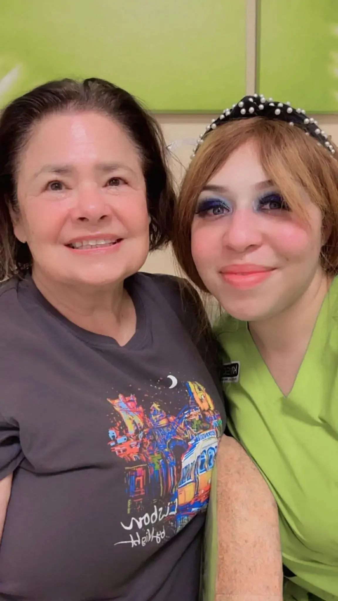 A woman smiling with her esthetician after her anti aging facial at Kiwi Spa San Diego