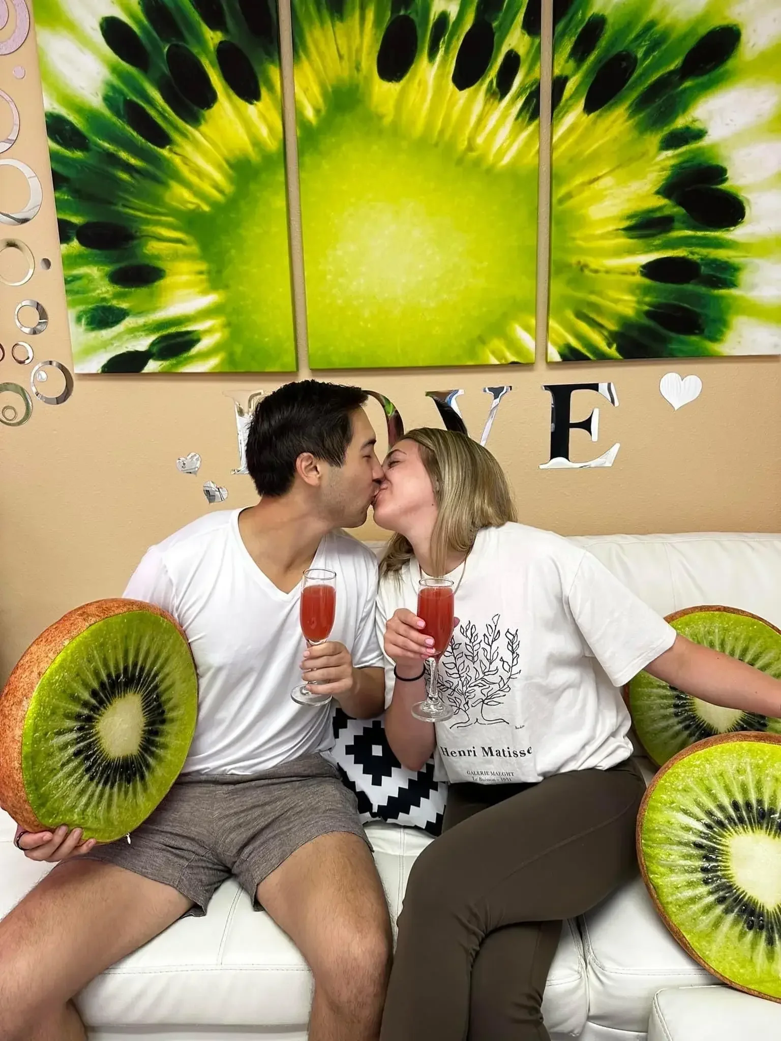 A couple kissing during their couples facial at Kiwi Spa San Diego