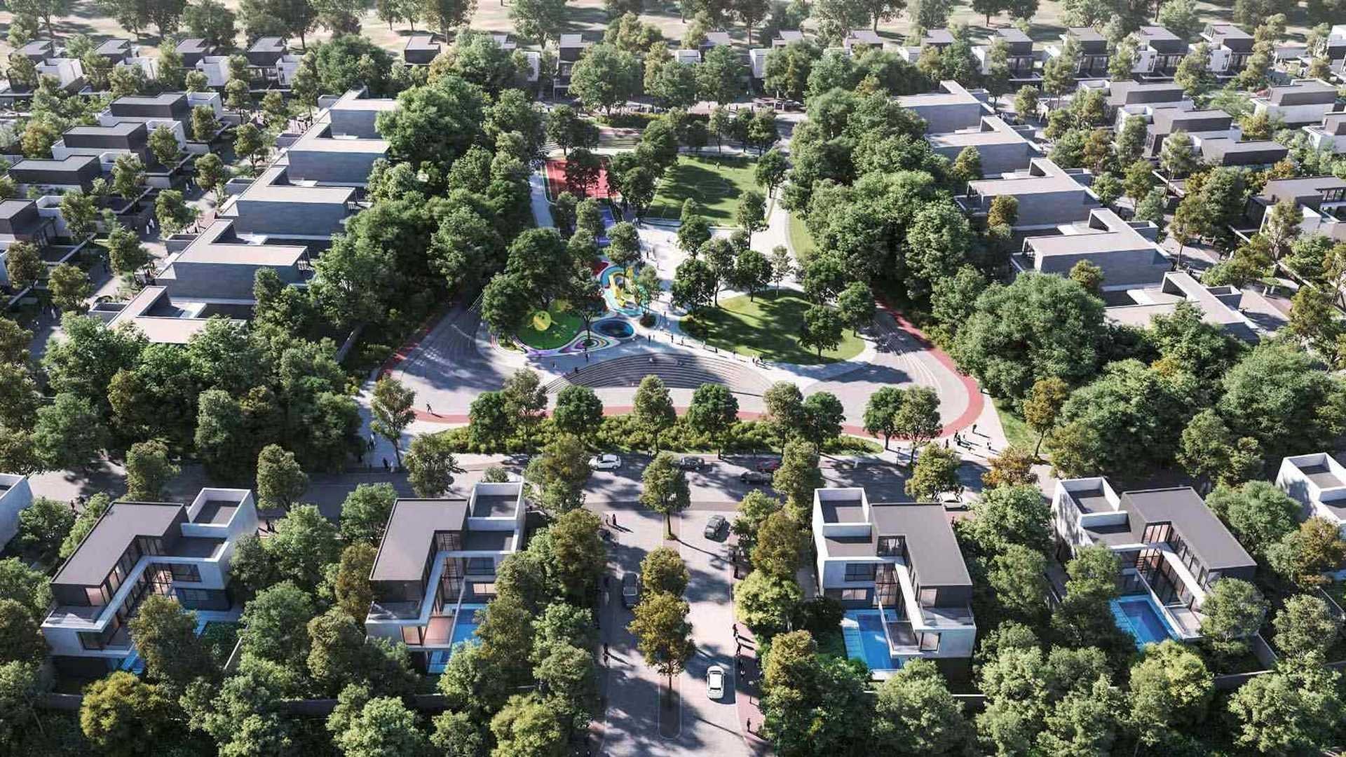 Aerial view of a residential neighborhood with modern houses, a central park with green trees, walking paths, colorful playground equipment, and a sports court.