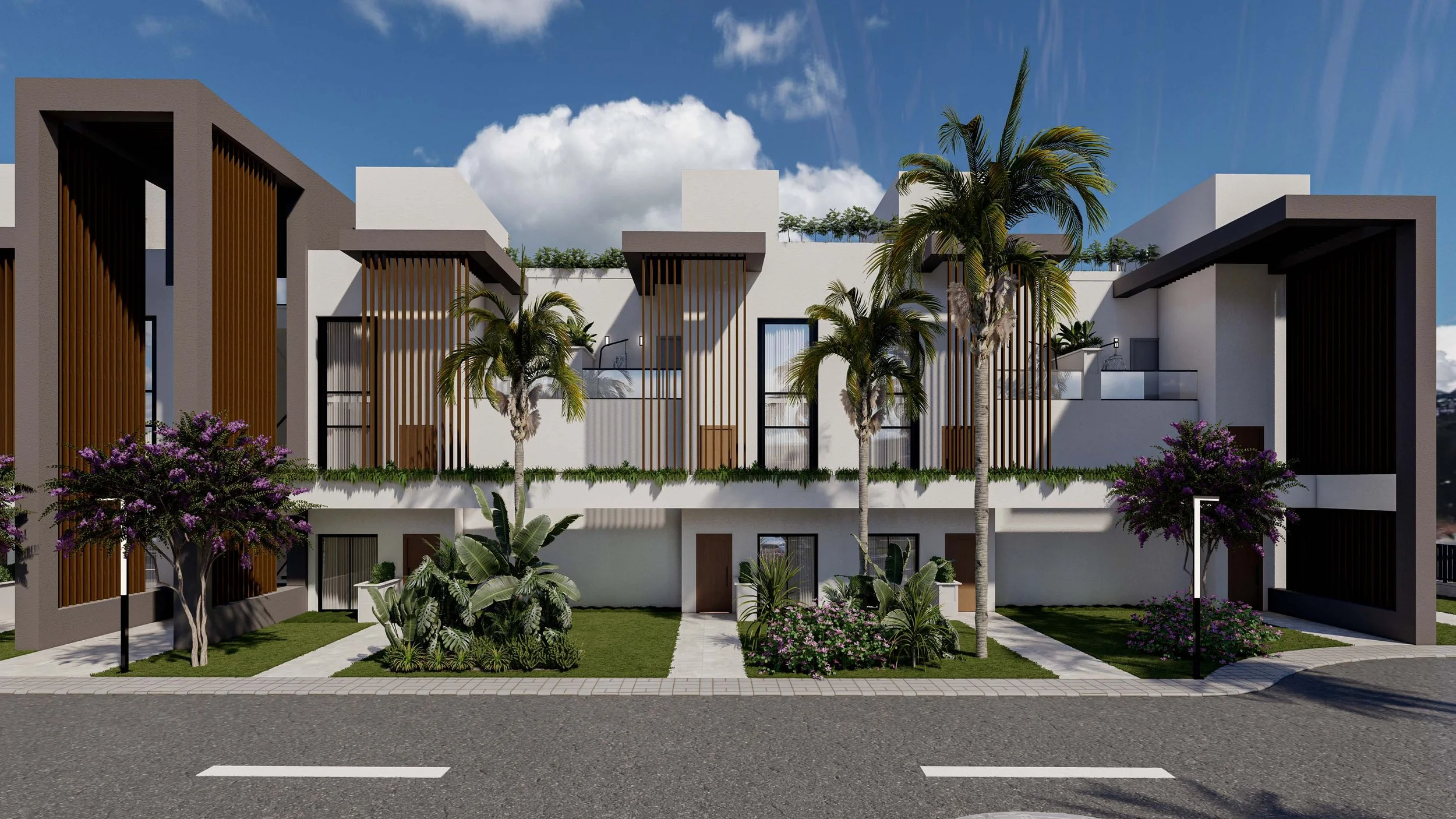 Modern multi-story residential building with white and dark gray walls, wooden lattice accents, palm trees, flowering bushes, and green landscaping along a city street with a blue sky