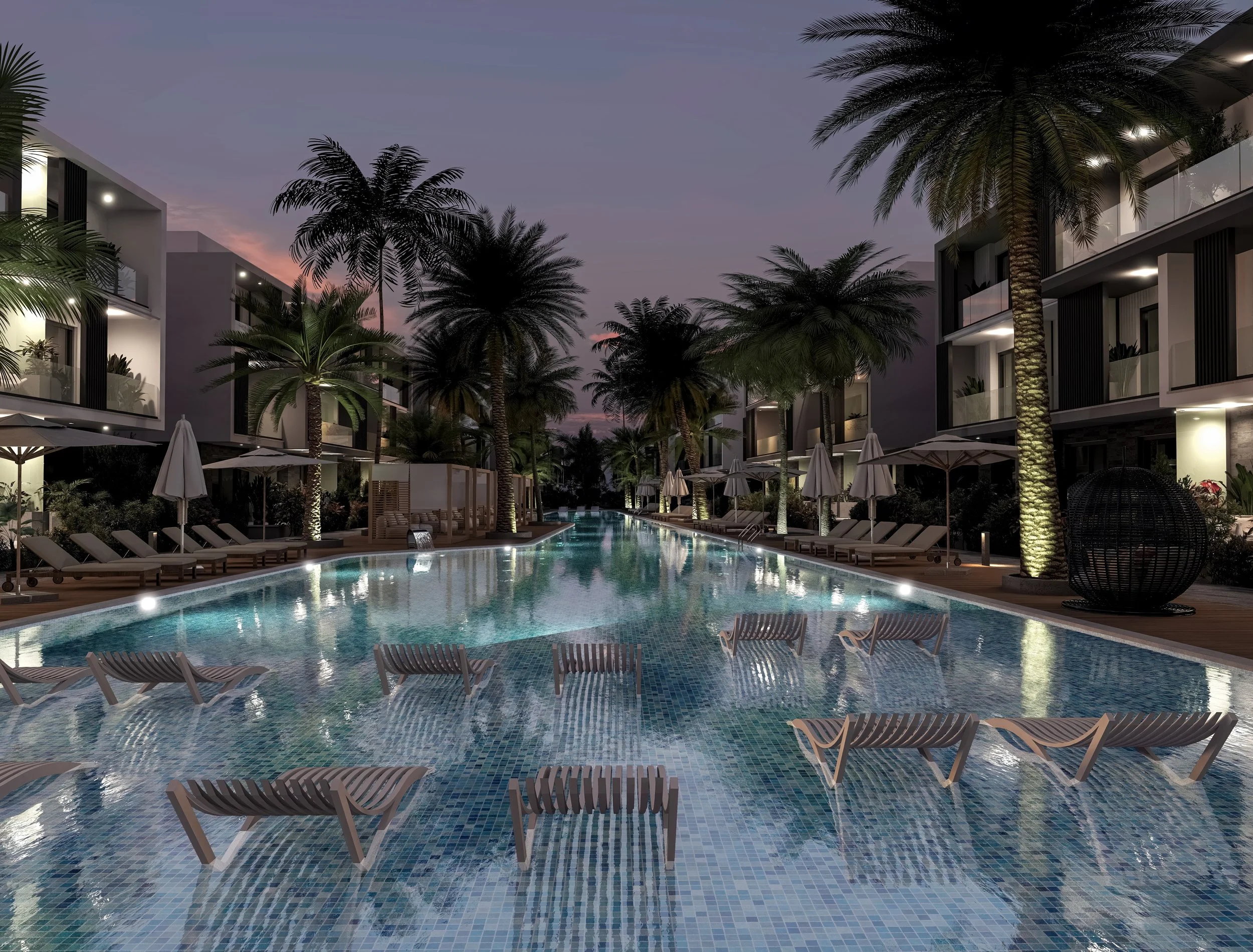 Night view of an outdoor hotel pool with palm trees, lounge chairs, umbrellas, and modern buildings