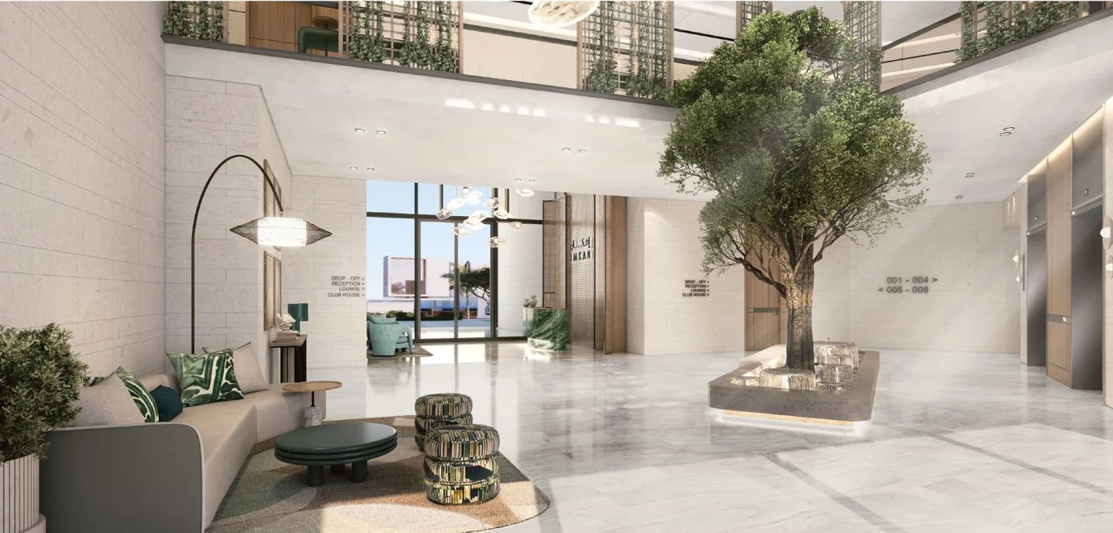 Modern hotel lobby with large indoor tree, marble floors, contemporary seating, and floor-to-ceiling windows.