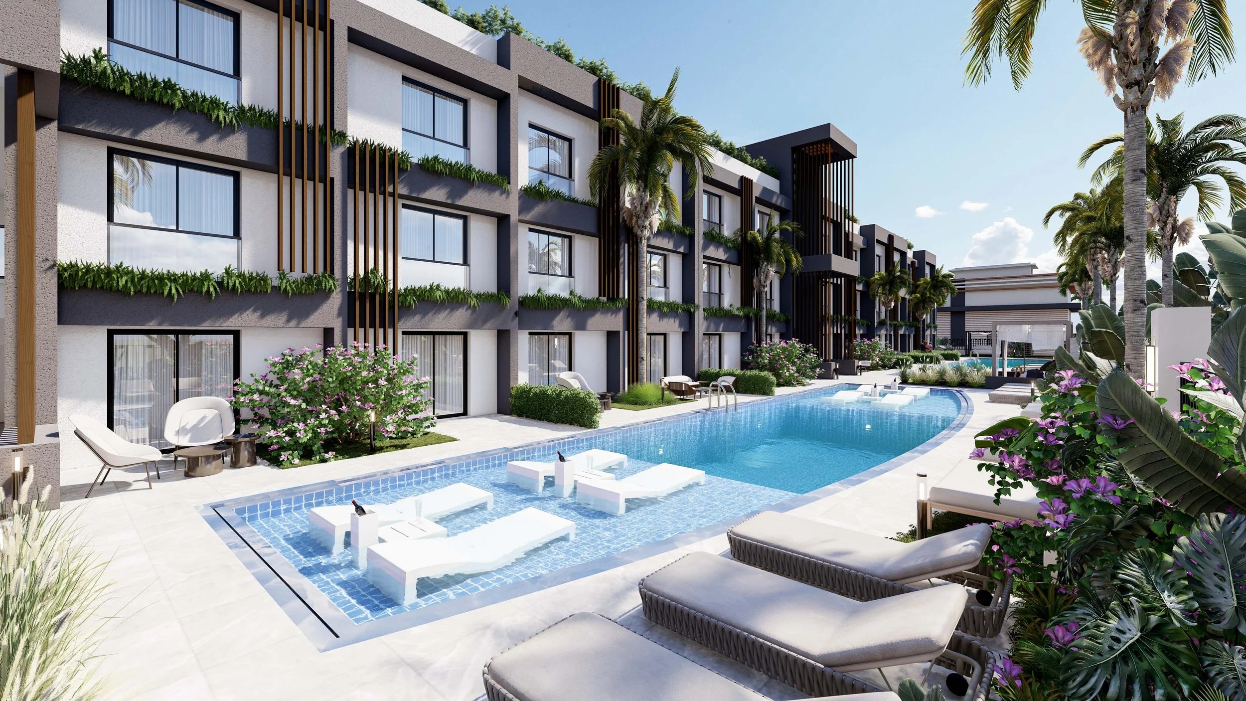 Modern apartment complex with a pool, palm trees, lounge chairs, and lush greenery under a clear sky.