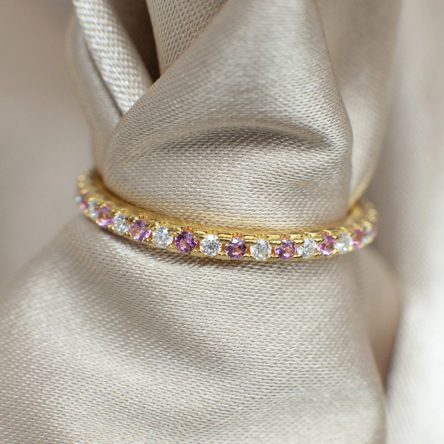 Delicate 1.5 mm round-cut moissanite eternity band with timeless sparkle, perfect for stacking or everyday wear.