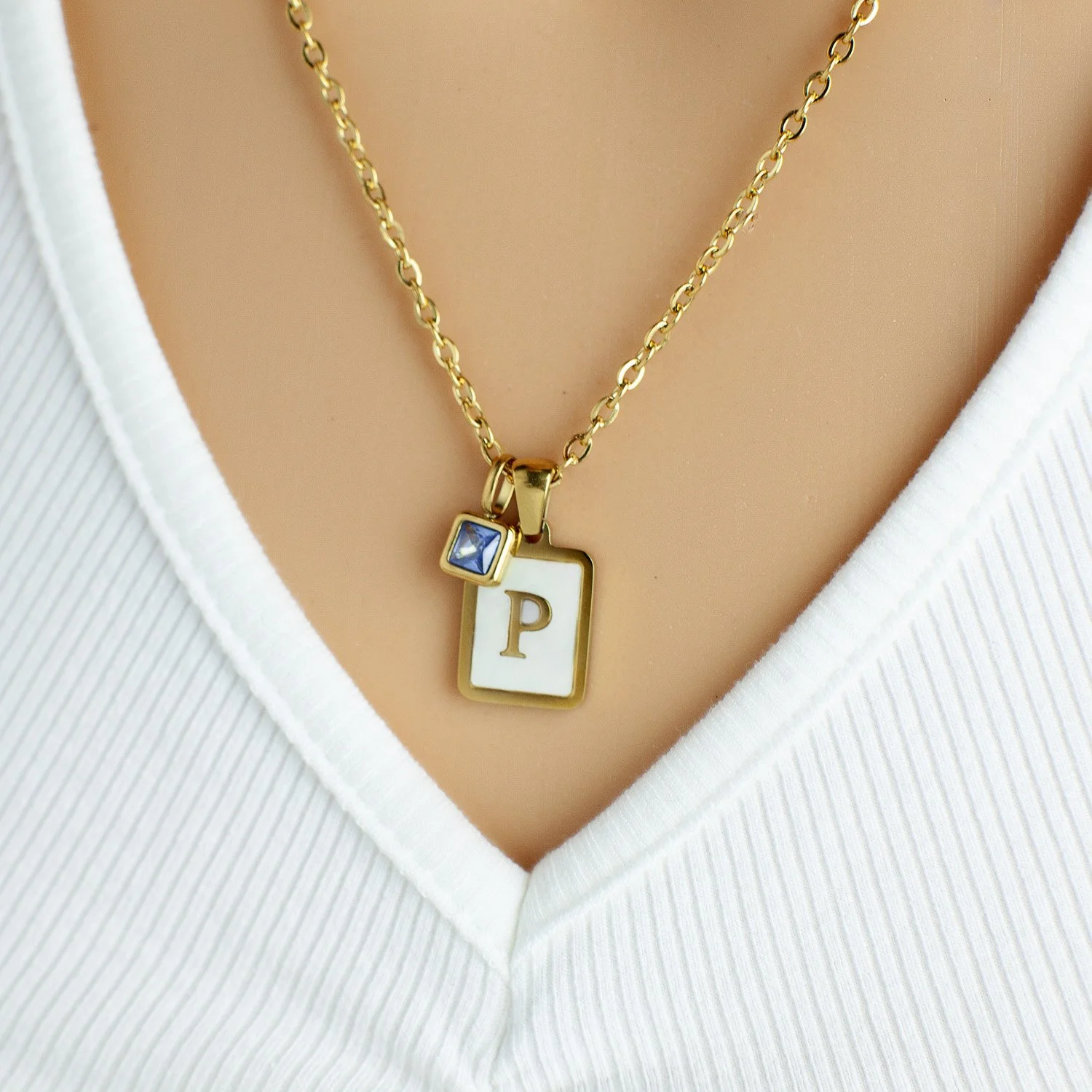 gold necklace with mother of pearl initial and birthstone charm