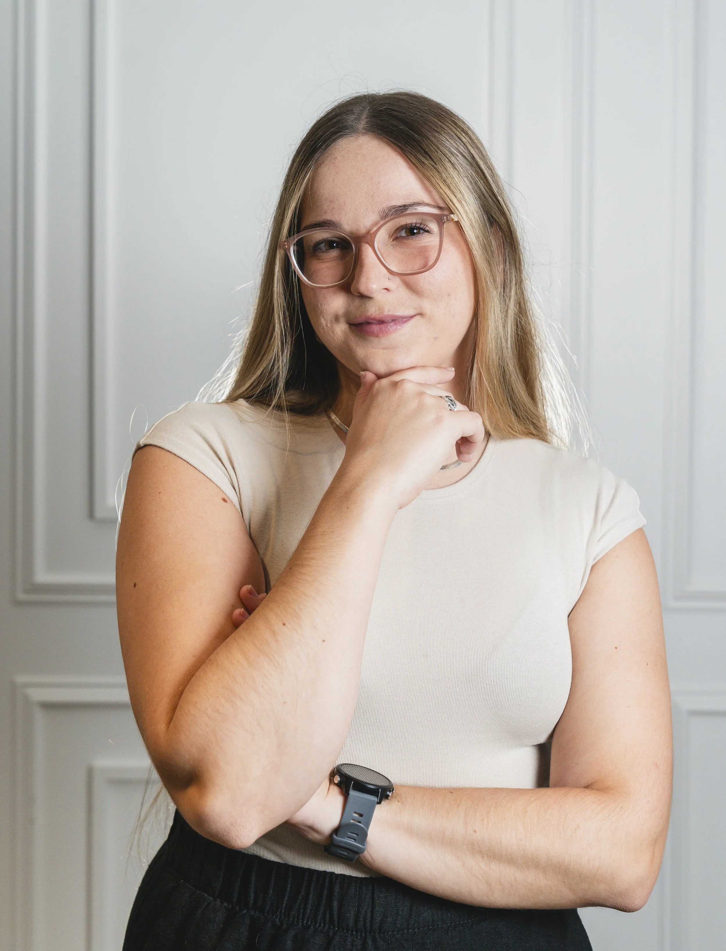 Woman smiles slightly while looking forwards