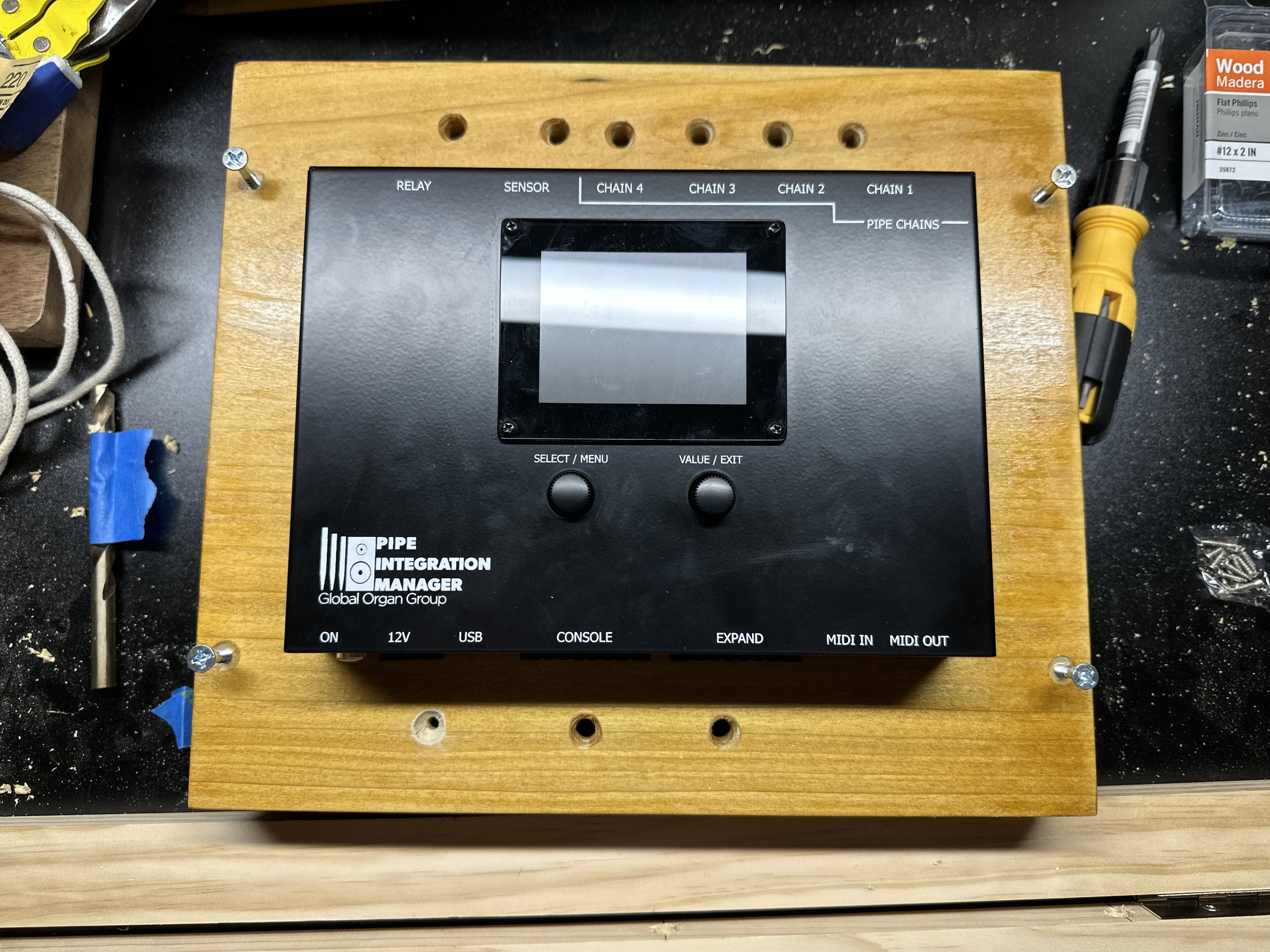 The new Rodgers PIM2 (Pipe Interface Manager) mounted to a board finished with organ shellac match the Austin Universal Airbox.  The PIM2 is the "brains" of the Rodgers pipe control system.  This unit is programmed for all the stops, keys and other c