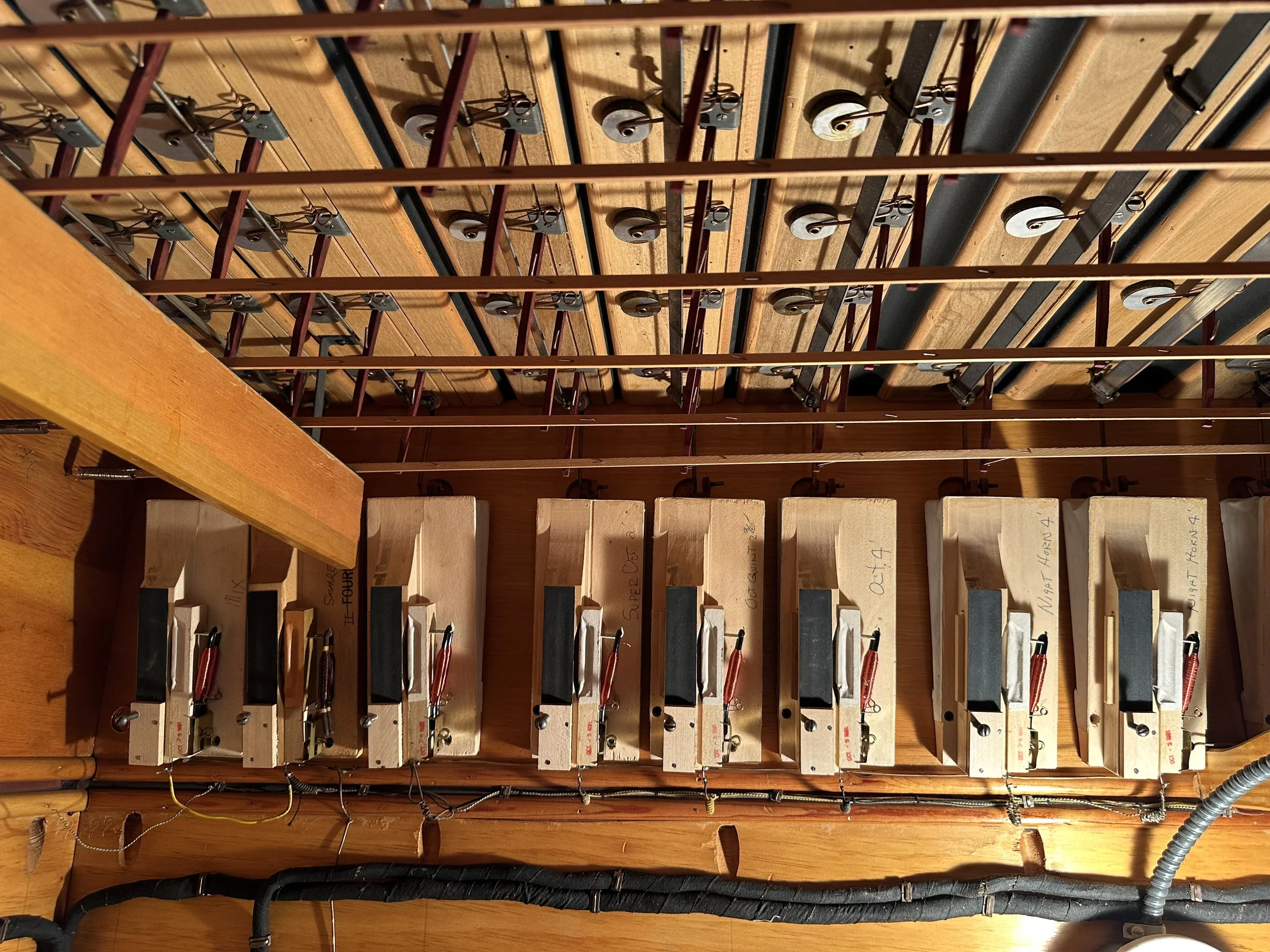 Original cotton-covered wiring underneath the Austin actions.