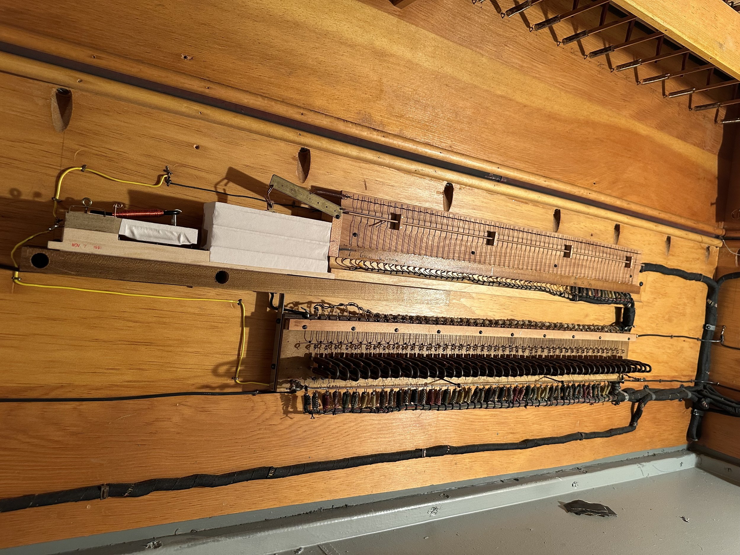 An original Austin "borrow" switch mounted to the side of the chest wall and exhausts the pneumatic to the outside air.  Many of these wire contacts were corroded from years of arching and use.  They have been replaced with modern driver boards.