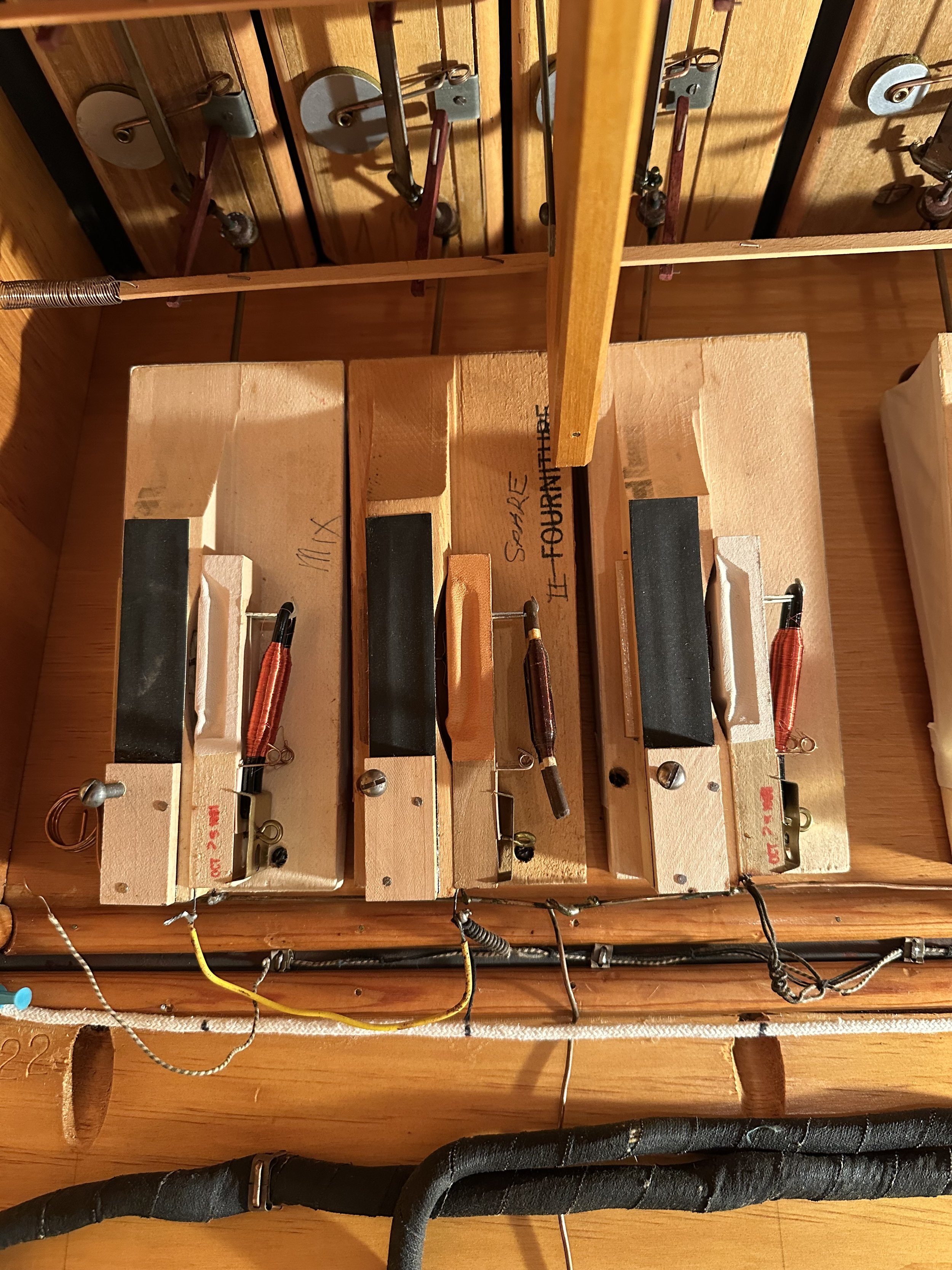 The Austin pneumatics were replaced in 1991, but the original cotton-covered wiring was kept.  Here you can see some modifications to the wiring over the years.