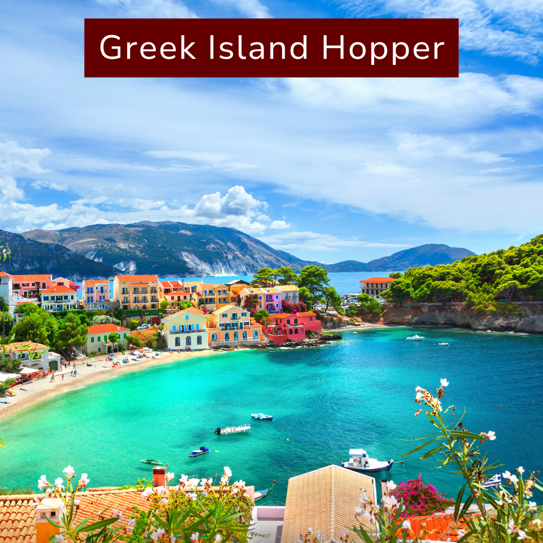 Colorful houses along a turquoise bay with boats, green trees, and mountains in the background under a partly cloudy sky, labeled Greek Island Hopper.