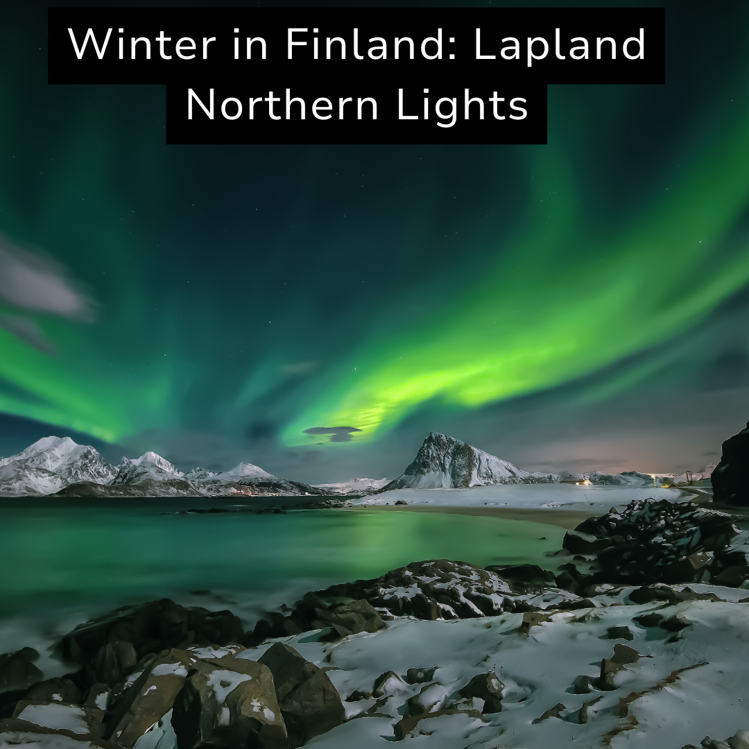 A snowy landscape in Finland with mountains and a lake at night, showcasing the northern lights in the sky.