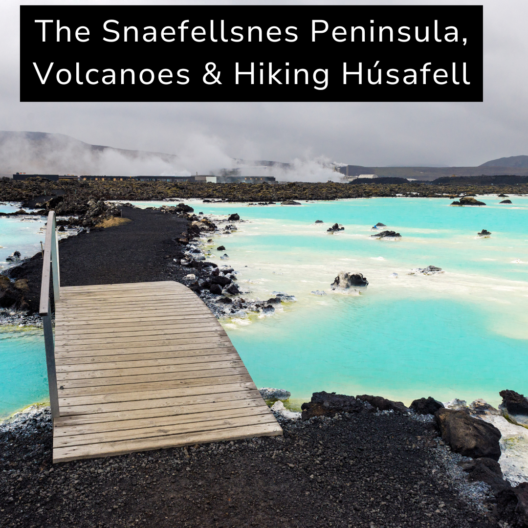 View of the Snaefellsnes Peninsula with thermal pools, volcanic rocks, and steam rising in the background, cloudy sky, and a wooden footbridge in the foreground.