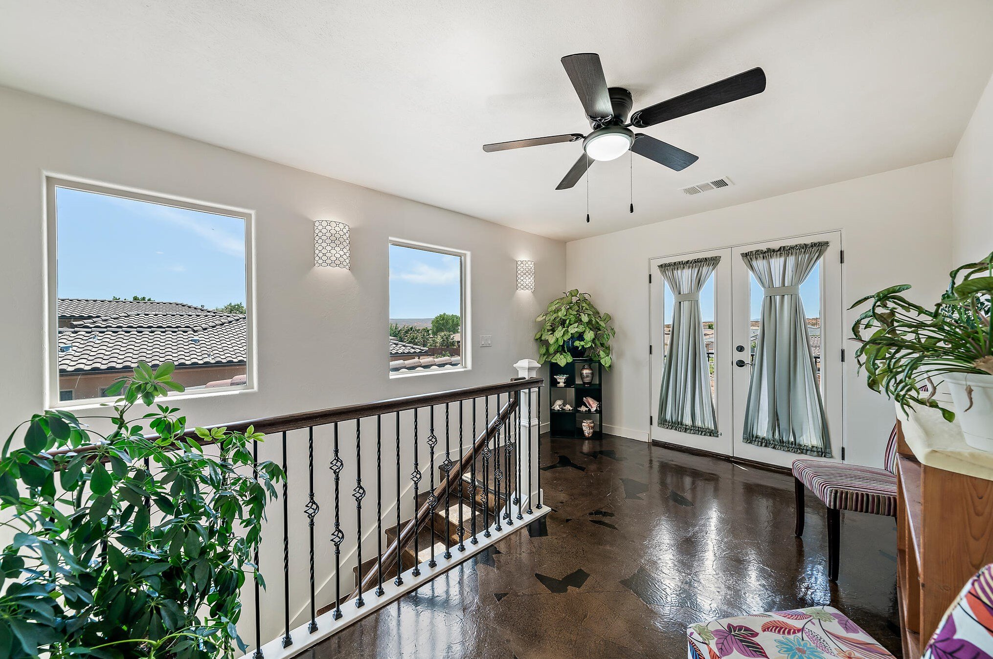 quaint open with lots of light sitting room open to upper deck