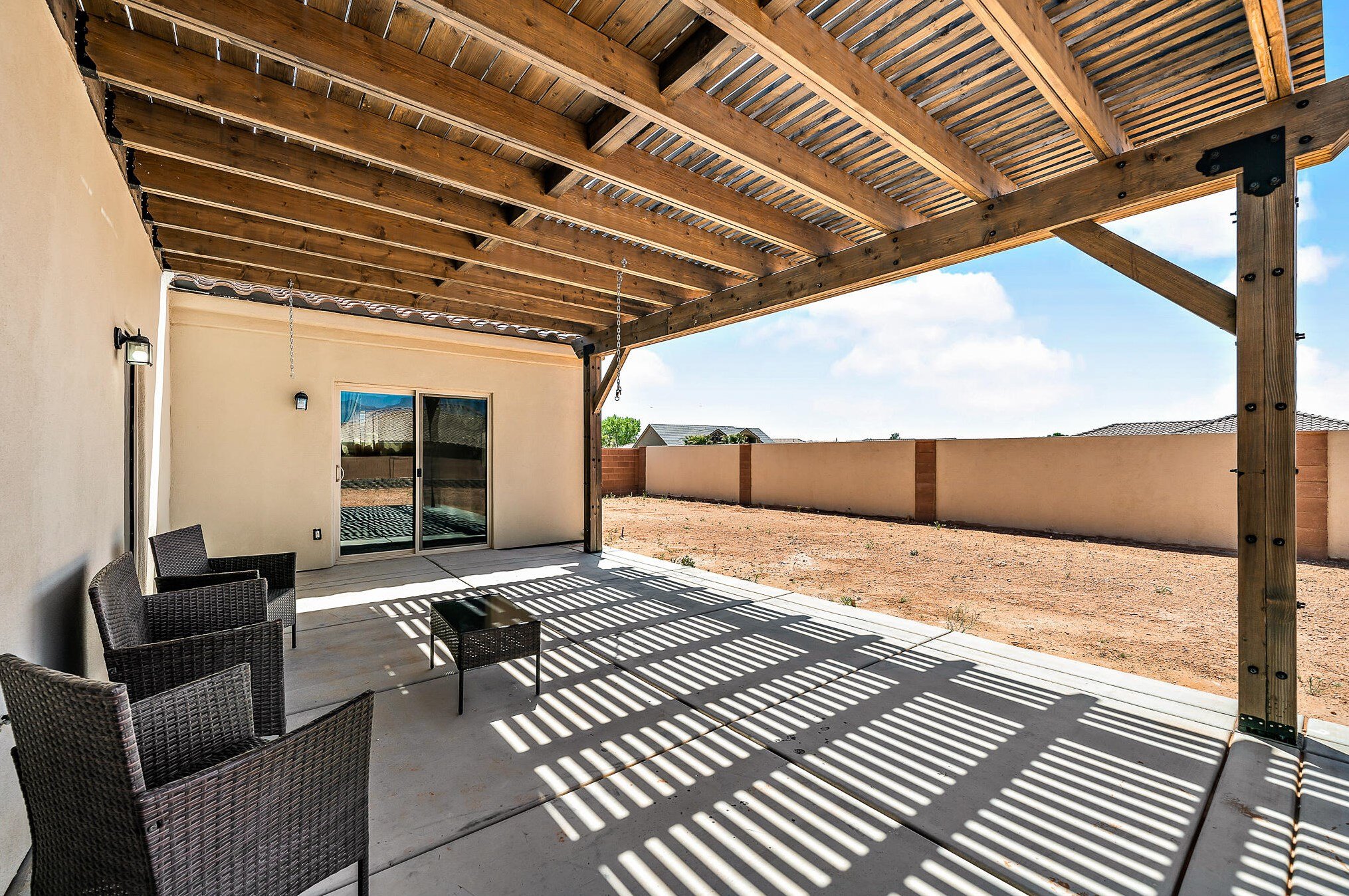 covered deck with awning, large back yard, master bedroom opens to outdoors