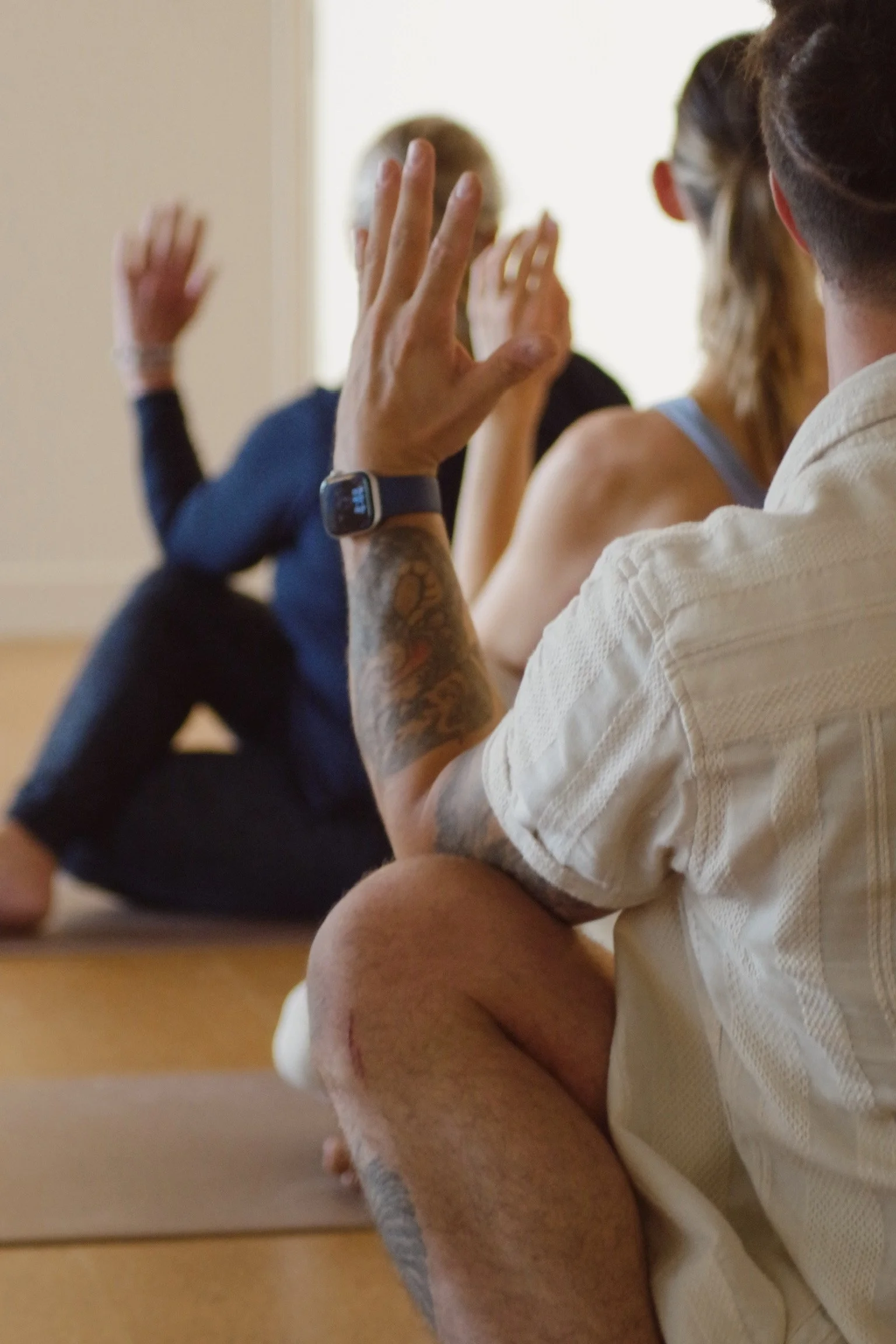 A woman practicing yoga, heart opening pose, somatic movement.