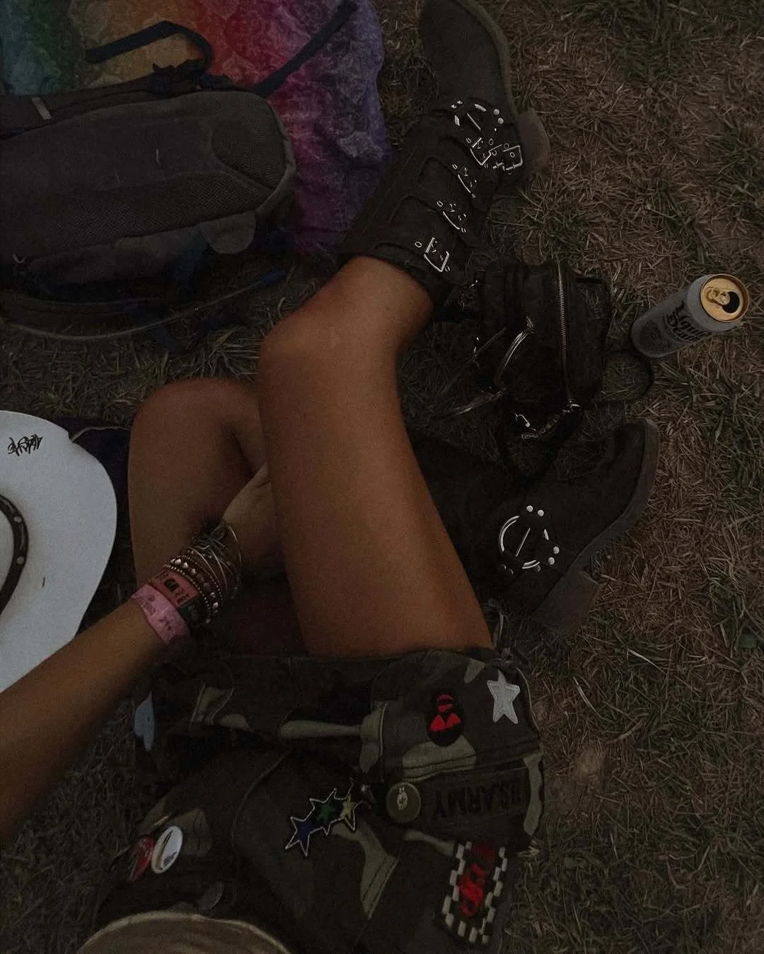 Brown boots styled with a camo patch mini skirt for a summer festival outfit.