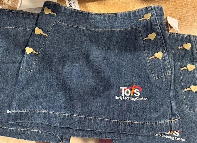 Custom logo embroidery on denim skirts for school uniforms order in Parkville Maryland