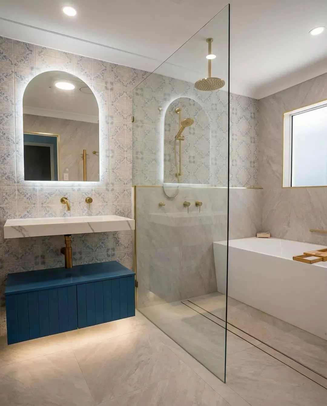 This one has a bit of everything. A spacious wet room with a strip drain, brushed brass fixtures, feature tiles and a bath to finish it off. The kind of bathroom that feels open, practical and just works really well. #wetroomdesign #bathroomideas #mo