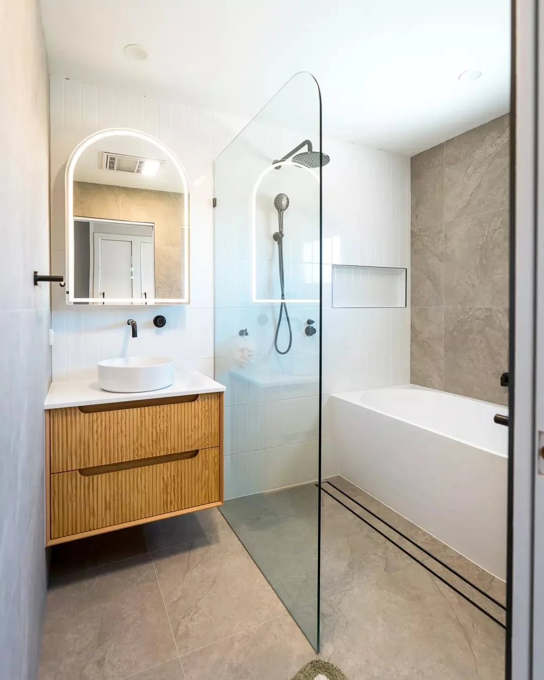 Warm timber, soft lighting and clean lines&hellip; this is what happens when everything just works without trying too hard. #bathroomdesign #modernbathroom #interiorinspo #renovationideas #cleanlines