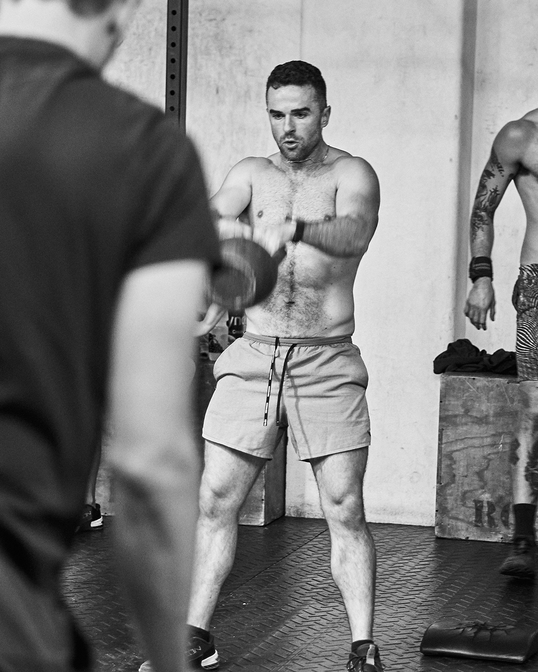 Man doing a kettlebell exercise at the gym
