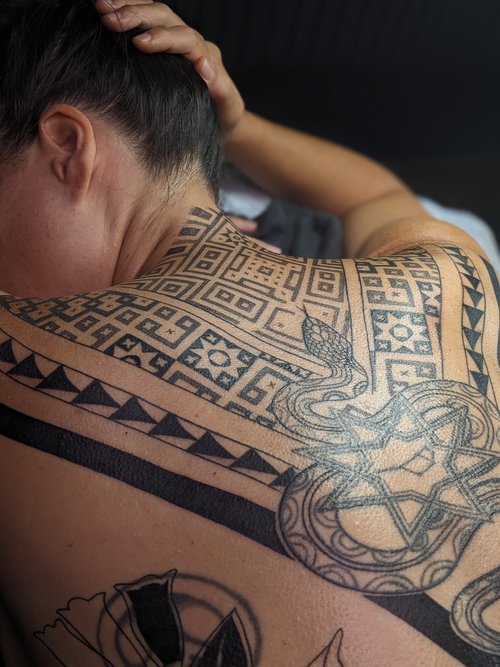 Indigenous pattern black modern tribal tattoo work on back
