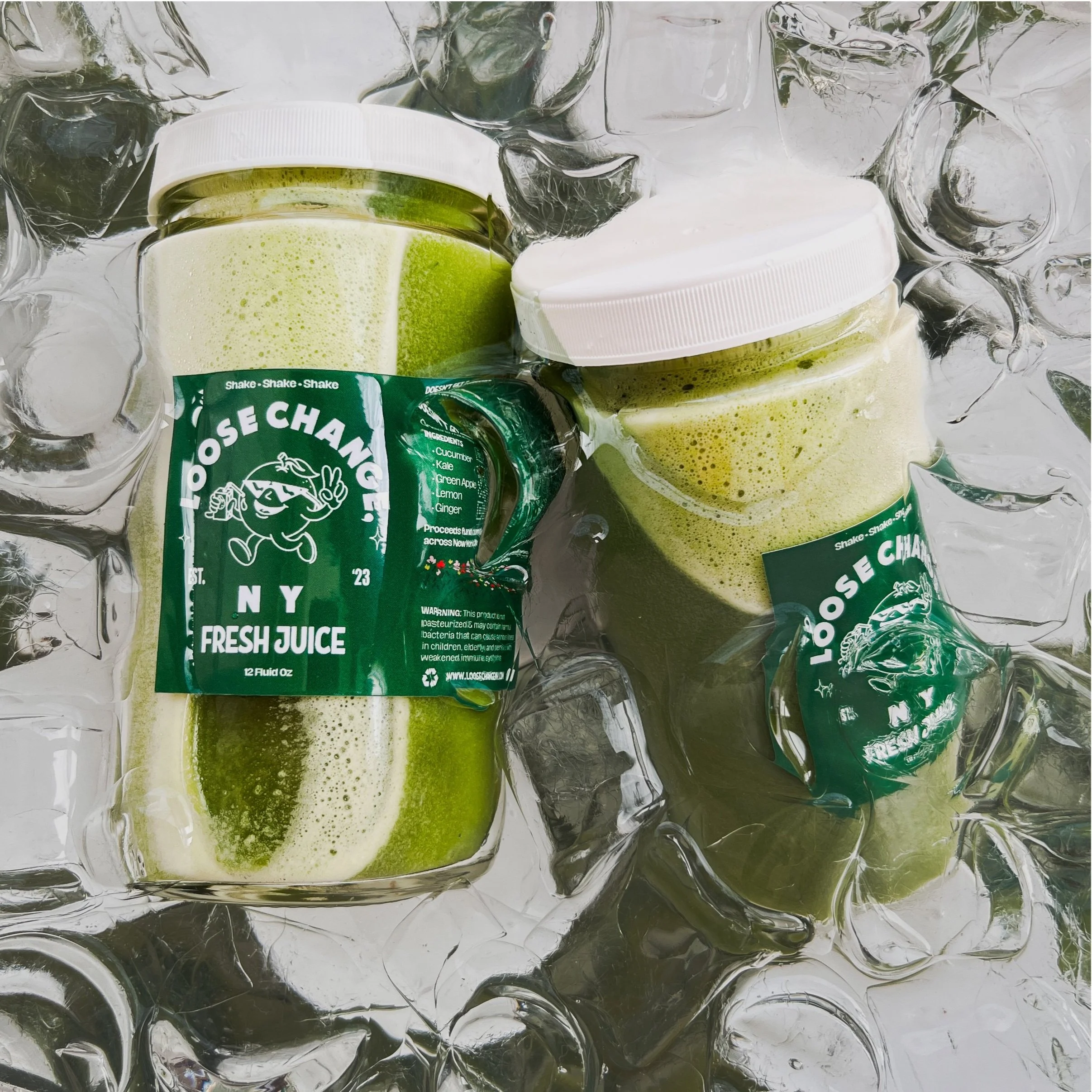 Two jars of green juice labeled 'Loose Change NY Fresh Juice' on ice.