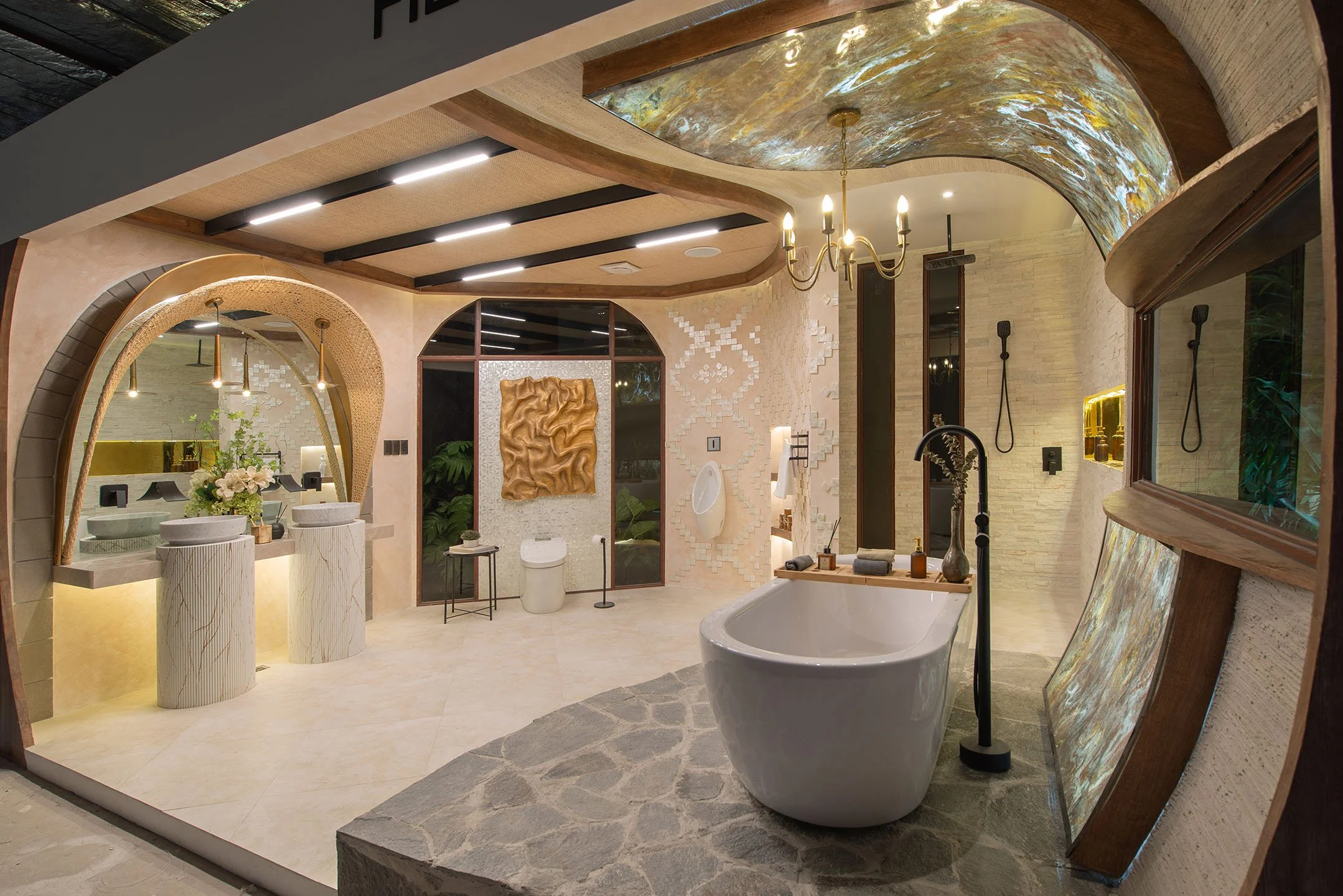 A luxurious bathroom with a freestanding bathtub, a large mirror with a decorative frame, multiple sinks with marble countertops, and unique ceiling design with lighting fixtures and a chandelier.