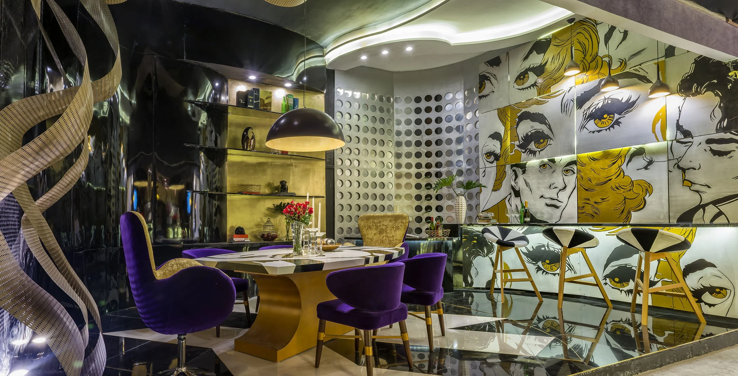 Modern interior with purple velvet chairs around a table with flowers, gold and black decor, comic-style wall art, and a bar area.