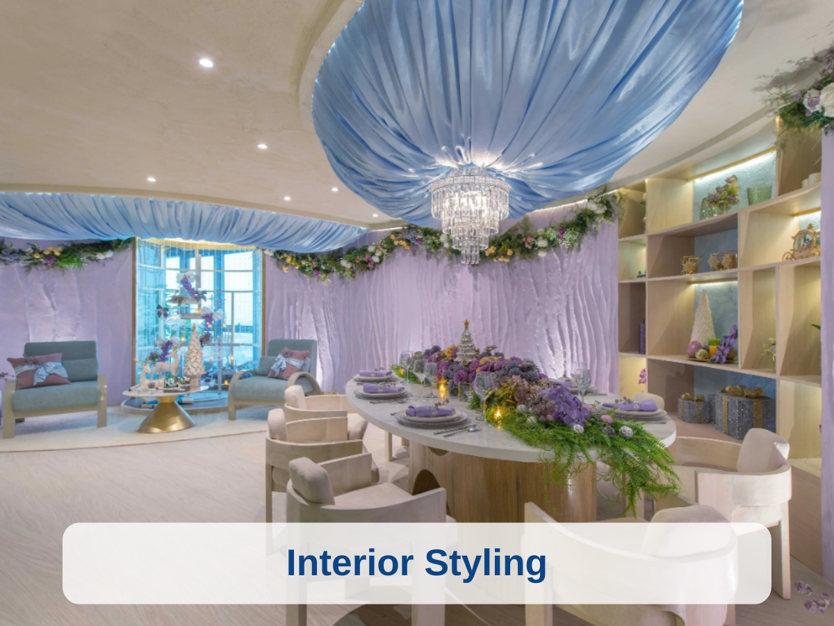 Elegant indoor dining room with purple and lavender decor, floral arrangements, and a mix of modern and classic furnishings.
