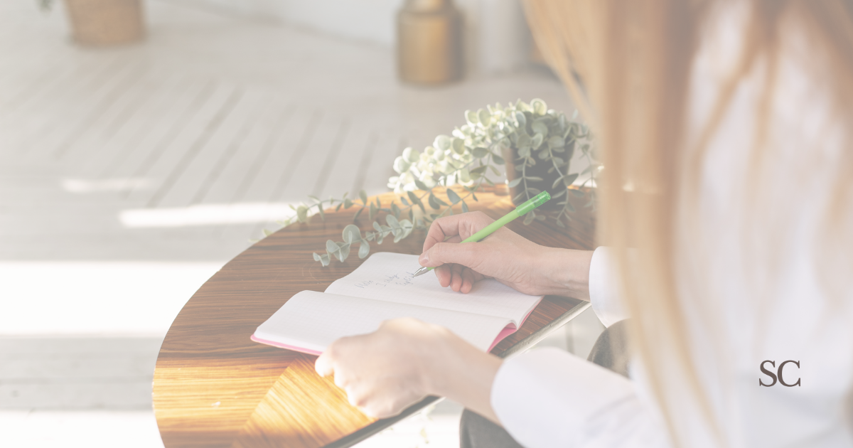Journaling moment — quiet reflection with tea in a calm space.